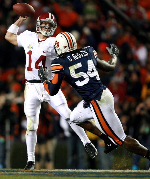 AUBURN, AL - NOVEMBER 24:  Quarterback John Parker Wilson #14 of the Alabama Crimson Tide is forced to get rid of the ball early by linebacker Quentin Groves #54 of the Auburn Tigers at Jordan-Hare Stadium on November 24, 2007 in Auburn, Alabama.  Auburn