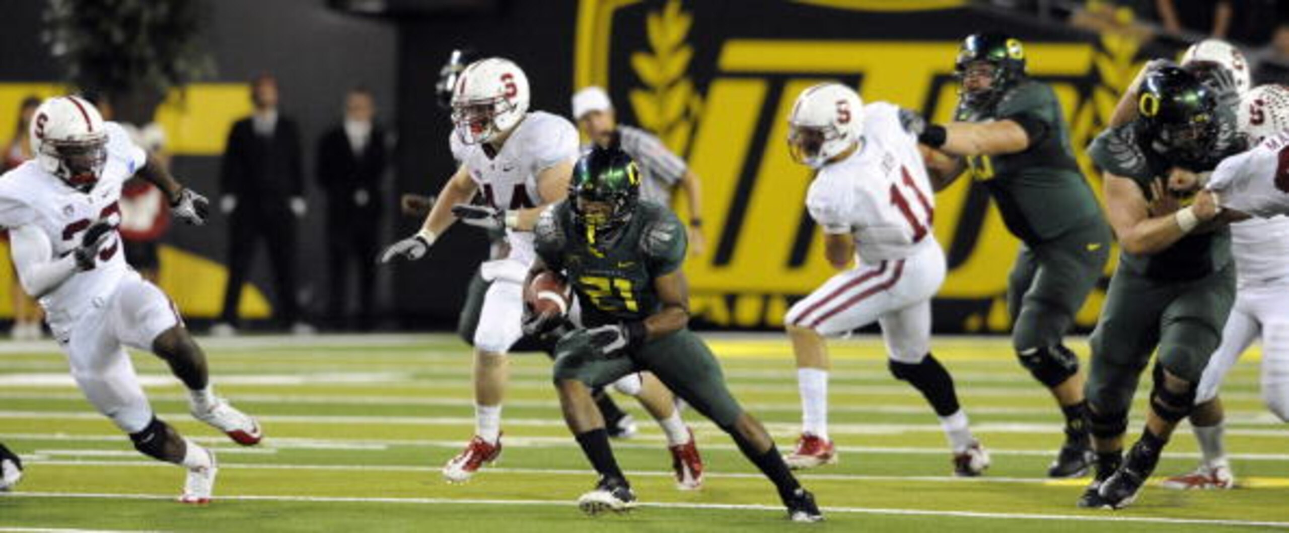 EUGENE, OR - OCTOBER 2: Running back LaMichael James #21 of the Oregon Ducks breaks into the open as linebacker Chase Thomas #44, safety Austin Yancey #23 and linebacker Shane Skov #11 of the Stanford Cardinal try to catch him during the third quarter of EUGENE, OR - OCTOBER 2: Running back LaMichael James #21 of the Oregon Ducks breaks into the open as linebacker Chase Thomas #44, safety Austin Yancey #23 and linebacker Shane Skov #11 of the Stanford Cardinal try to catch him during the third quarter of