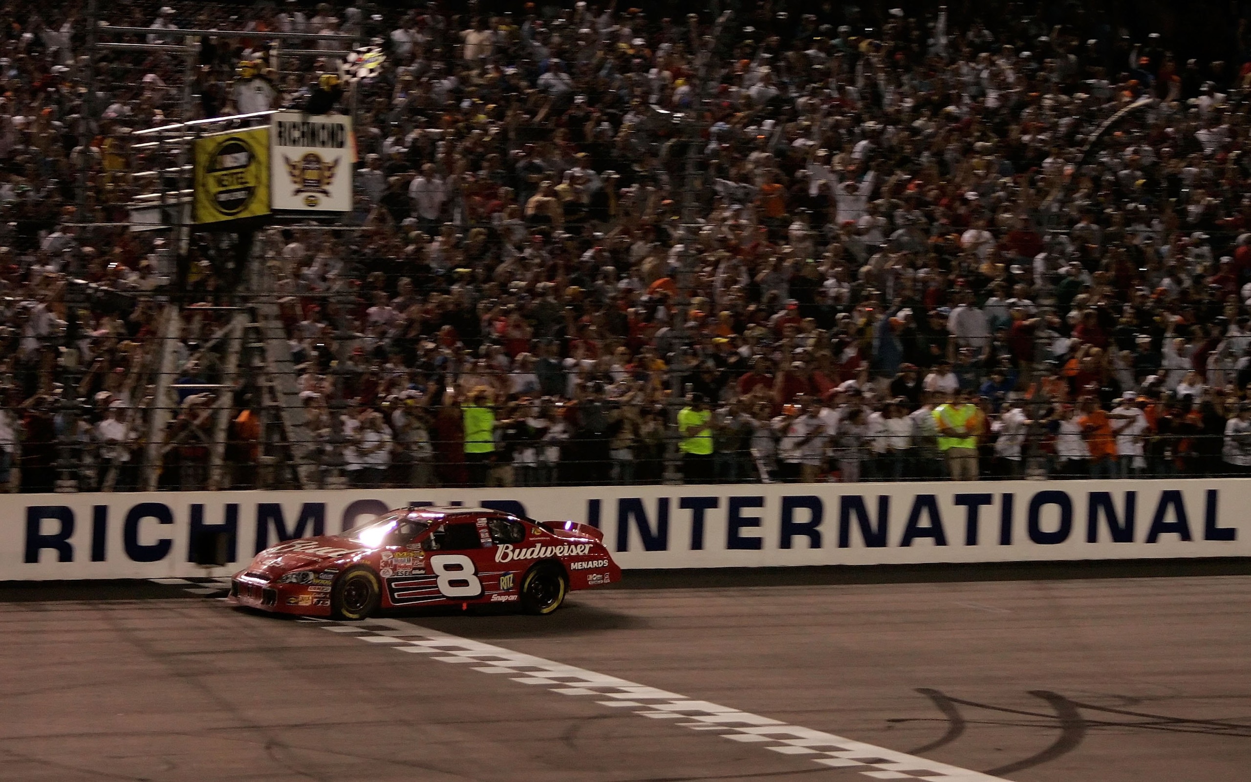RICHMOND, VA - MAY 06: Dale Earnhardt Jr., driver of the #8 car, takes the checkered flag to win the NASCAR Nextel Cup Series Crown Royal 400 May 6, 2006 in Richmond, Virgina. (Photo by Dilip Vishwanat/Getty Images for NASCAR) RICHMOND, VA - MAY 06: Dale Earnhardt Jr., driver of the #8 car, takes the checkered flag to win the NASCAR Nextel Cup Series Crown Royal 400 May 6, 2006 in Richmond, Virgina. (Photo by Dilip Vishwanat/Getty Images for NASCAR)