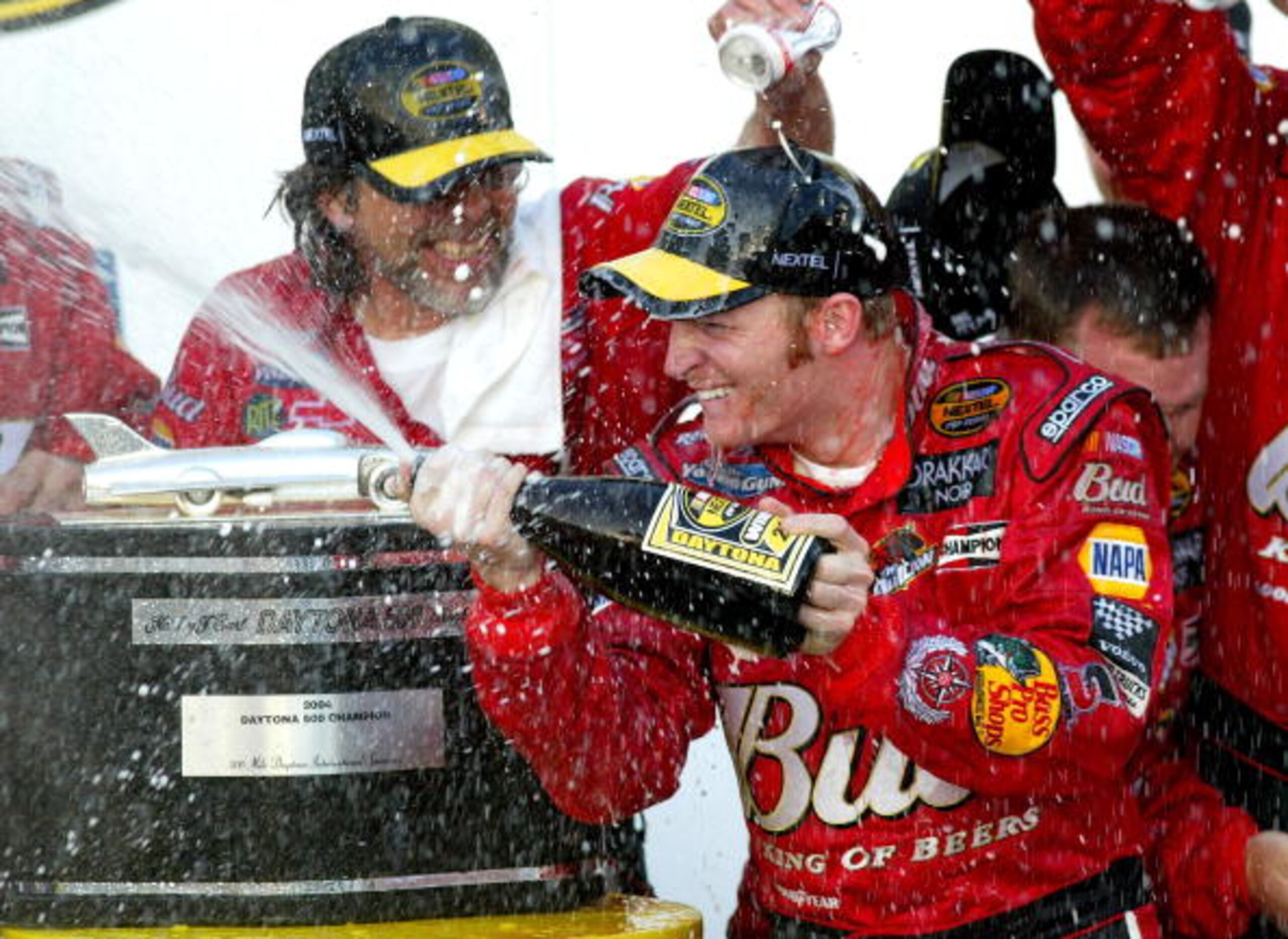 DAYTONA BEACH, FL - FEBRUARY 15: Dale Earnhardt Jr. driver of the #8 DEI Budweiser Chevrolet celebrates by spraying champagne in victory circle after winning the the NASCAR Nextel Cup Daytona 500 on February 15, 2004 at the Daytona International Speedway DAYTONA BEACH, FL - FEBRUARY 15: Dale Earnhardt Jr. driver of the #8 DEI Budweiser Chevrolet celebrates by spraying champagne in victory circle after winning the the NASCAR Nextel Cup Daytona 500 on February 15, 2004 at the Daytona International Speedway