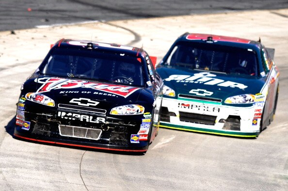 MARTINSVILLE, VA - APRIL 03:  Kevin Harvick, driver of the #29 Budweiser Chevrolet, leads Dale Earnhardt Jr., driver of the #88 Amp Energy/National Guard Chevrolet, during the NASCAR Sprint Cup Series Goody's Fast Relief 500 at Martinsville Speedway on Ap