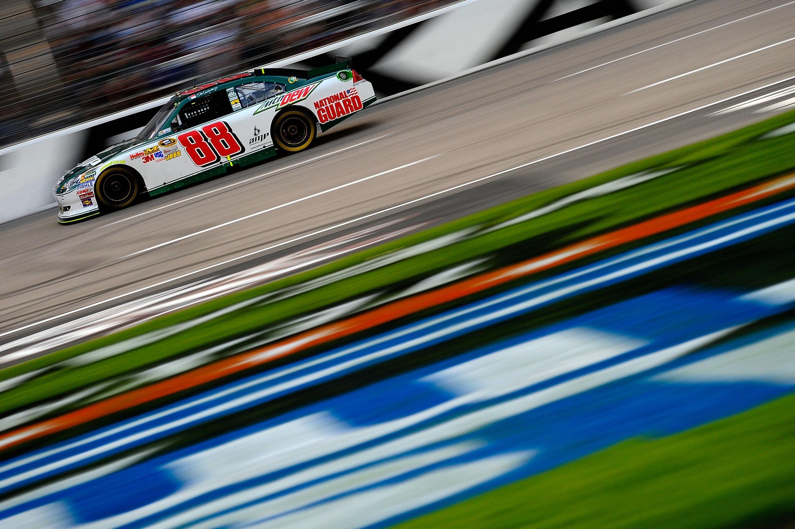 FORT WORTH, TX - APRIL 09: Dale Earnhardt Jr., driver of the #88 Amp Energy/National Guard Chevrolet, races during the NASCAR Sprint Cup Series Samsung Mobile 500 at Texas Motor Speedway on April 9, 2011 in Fort Worth, Texas. (Photo by Jared C. Tilton/G FORT WORTH, TX - APRIL 09: Dale Earnhardt Jr., driver of the #88 Amp Energy/National Guard Chevrolet, races during the NASCAR Sprint Cup Series Samsung Mobile 500 at Texas Motor Speedway on April 9, 2011 in Fort Worth, Texas. (Photo by Jared C. Tilton/G