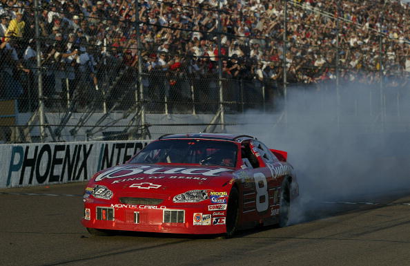 PHOENIX, AZ- NOVEMBER 2:  Dale Earnhardt Jr. celebrates his victory in his #8 Budweiser Chevrloet during the NASCAR Winston Cup Checker Auto Parts 500 on November 2, 2003 at Phoenix International Raceway in Phoenix, Arizona. (Photo by Jon Ferrey/Getty Ima