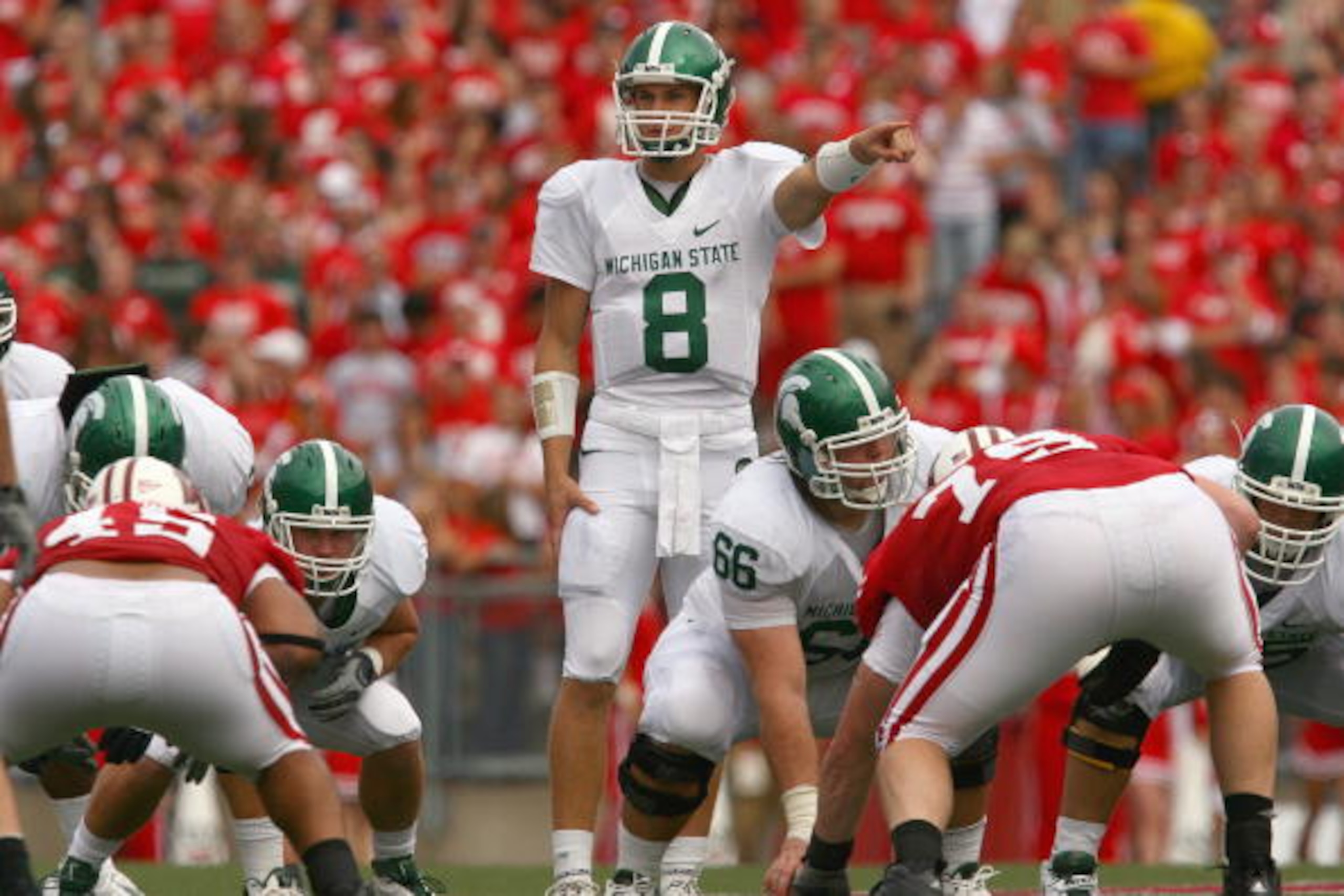 MADISON, WI - SEPTEMBER 26: Kirk Cousins #8 of the Michigan State Spartans motions on the line against the Wisconsin Badgers on September 26, 2009 at Camp Randall Stadium in Madison, Wisconsin. (Photo by Jonathan Daniel/Getty Images) MADISON, WI - SEPTEMBER 26: Kirk Cousins #8 of the Michigan State Spartans motions on the line against the Wisconsin Badgers on September 26, 2009 at Camp Randall Stadium in Madison, Wisconsin. (Photo by Jonathan Daniel/Getty Images)