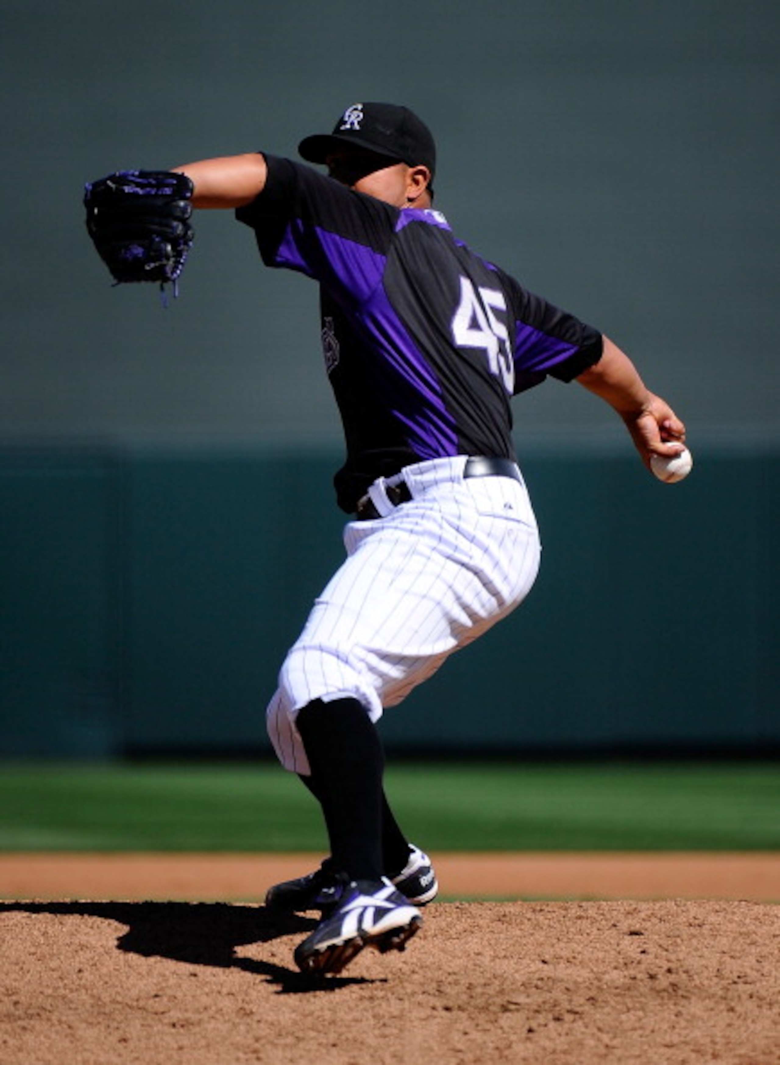 SCOTTSDALE, AZ - MARCH 14:  Pitcher Jhoulys Chacin #45 of the Colorodo Rockies throws against the Cincinnati Reds  during the spring training baseball game at Salt River Fields at Talking Stick on March 14, 2011 in Scottsdale, Arizona.  (Photo by Kevork D