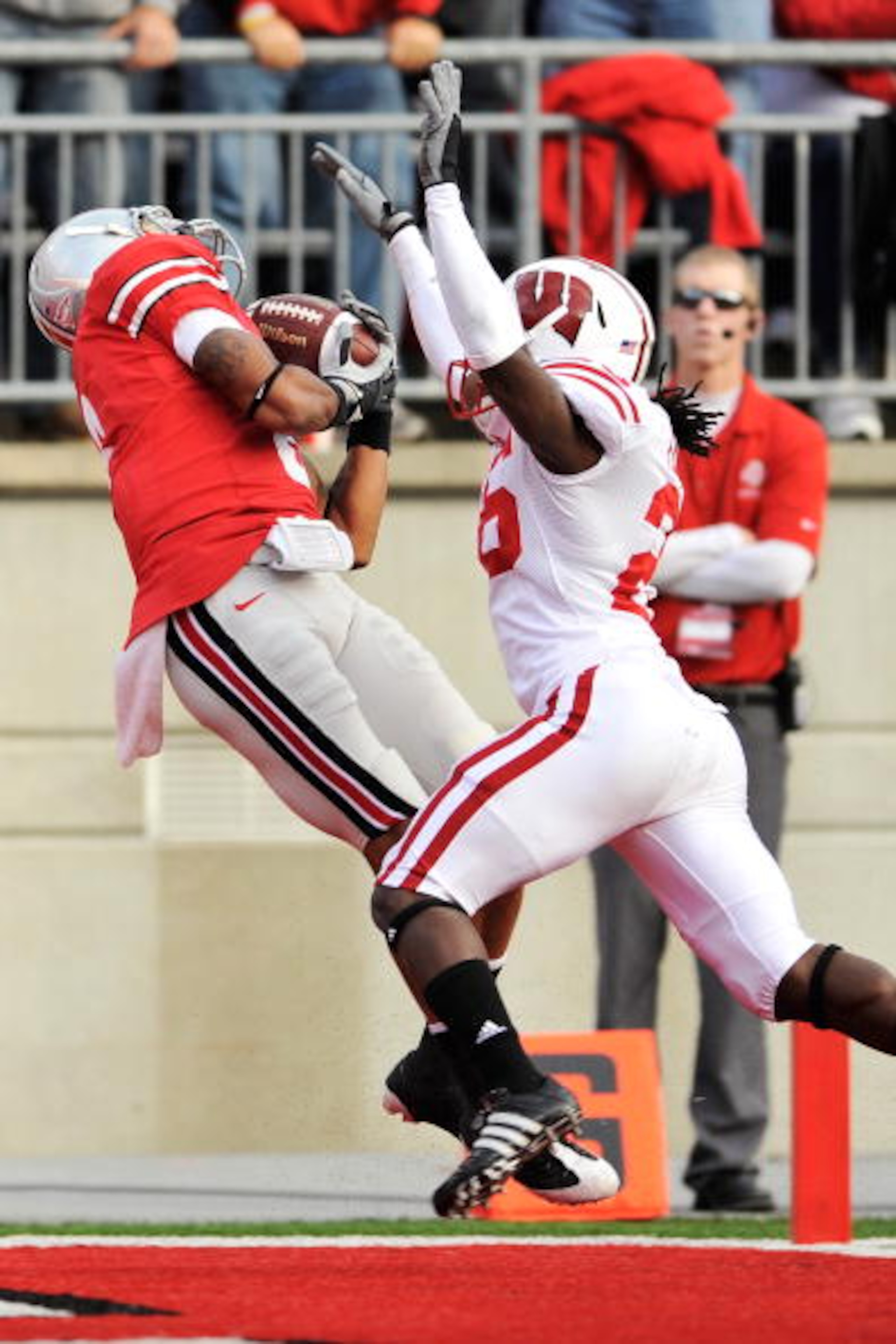 COLUMBUS, OH - OCTOBER 10: DeVier Posey #8 of the Ohio State Buckeyes pulls in a 32-yard touchdown pass in front of Antonio Fenelus #26 of the Wisconsin Badgers at Ohio Stadium on October 10, 2009 in Columbus, Ohio. (Photo by Jamie Sabau/Getty Images) COLUMBUS, OH - OCTOBER 10: DeVier Posey #8 of the Ohio State Buckeyes pulls in a 32-yard touchdown pass in front of Antonio Fenelus #26 of the Wisconsin Badgers at Ohio Stadium on October 10, 2009 in Columbus, Ohio. (Photo by Jamie Sabau/Getty Images)