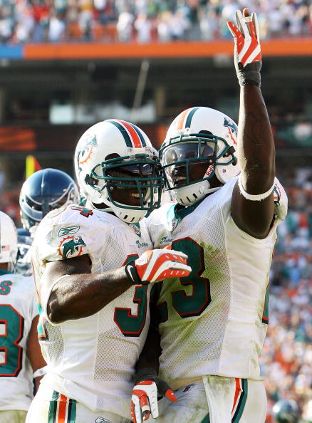 MIAMI - NOVEMBER 09:  Running back Ronnie Brown #23 and Ricky Williams #34 of the Miami Dolphins celebrate after Brown's touchdown run in the fourth quarter against the Seattle Seahawks at Dolphin Stadium on November 9, 2008 in Miami, Florida. The Dolphin