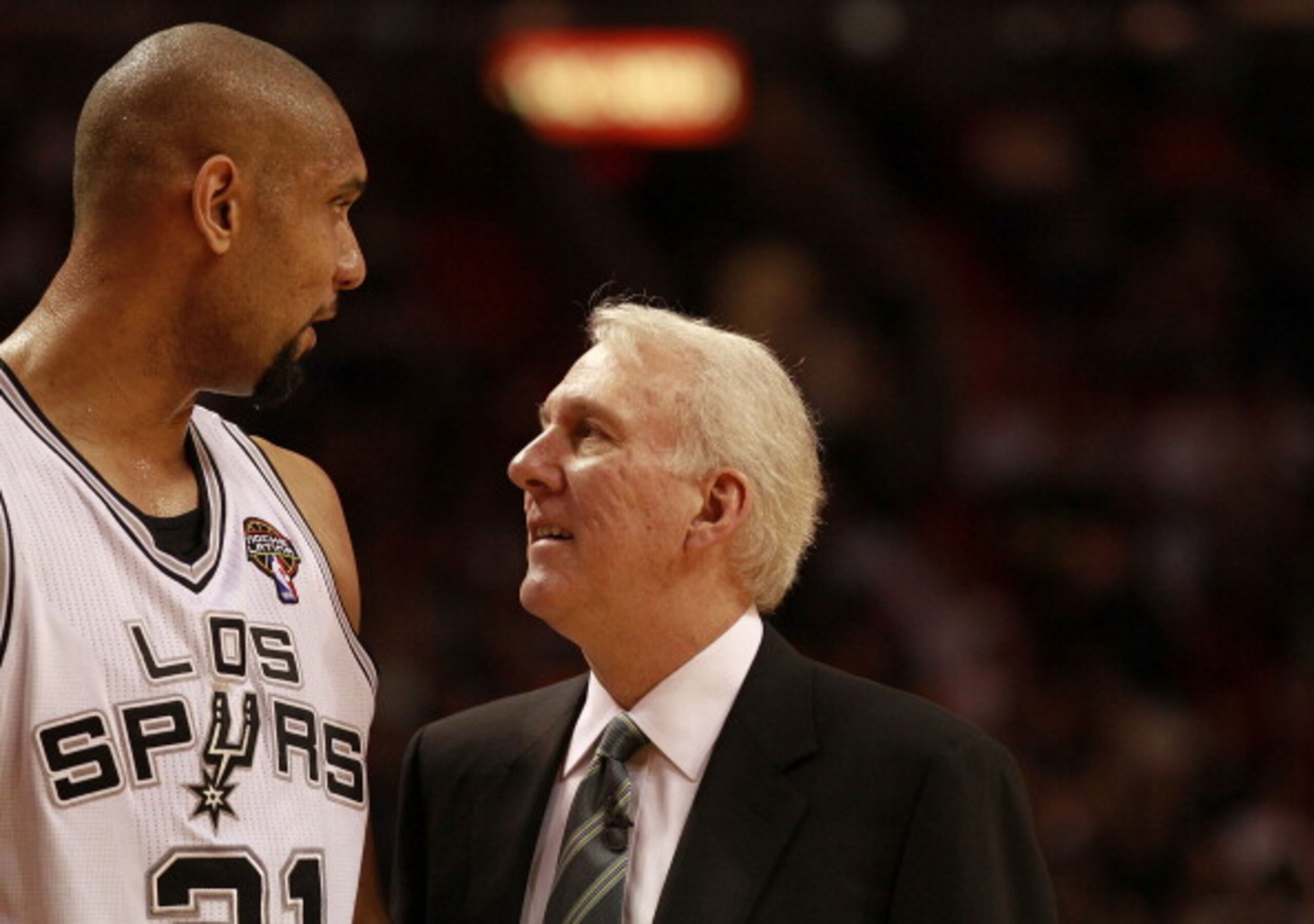 MIAMI - MARCH 14: Center Tim Duncan #21 of the San Antonio Spurs chats with his Coach Greg Popovich against the Miami Heat at American Airlines Arena on March 14, 2011 in Miami, Florida. NOTE TO USER: User expressly acknowledges and agrees that, by downl MIAMI - MARCH 14: Center Tim Duncan #21 of the San Antonio Spurs chats with his Coach Greg Popovich against the Miami Heat at American Airlines Arena on March 14, 2011 in Miami, Florida. NOTE TO USER: User expressly acknowledges and agrees that, by downl