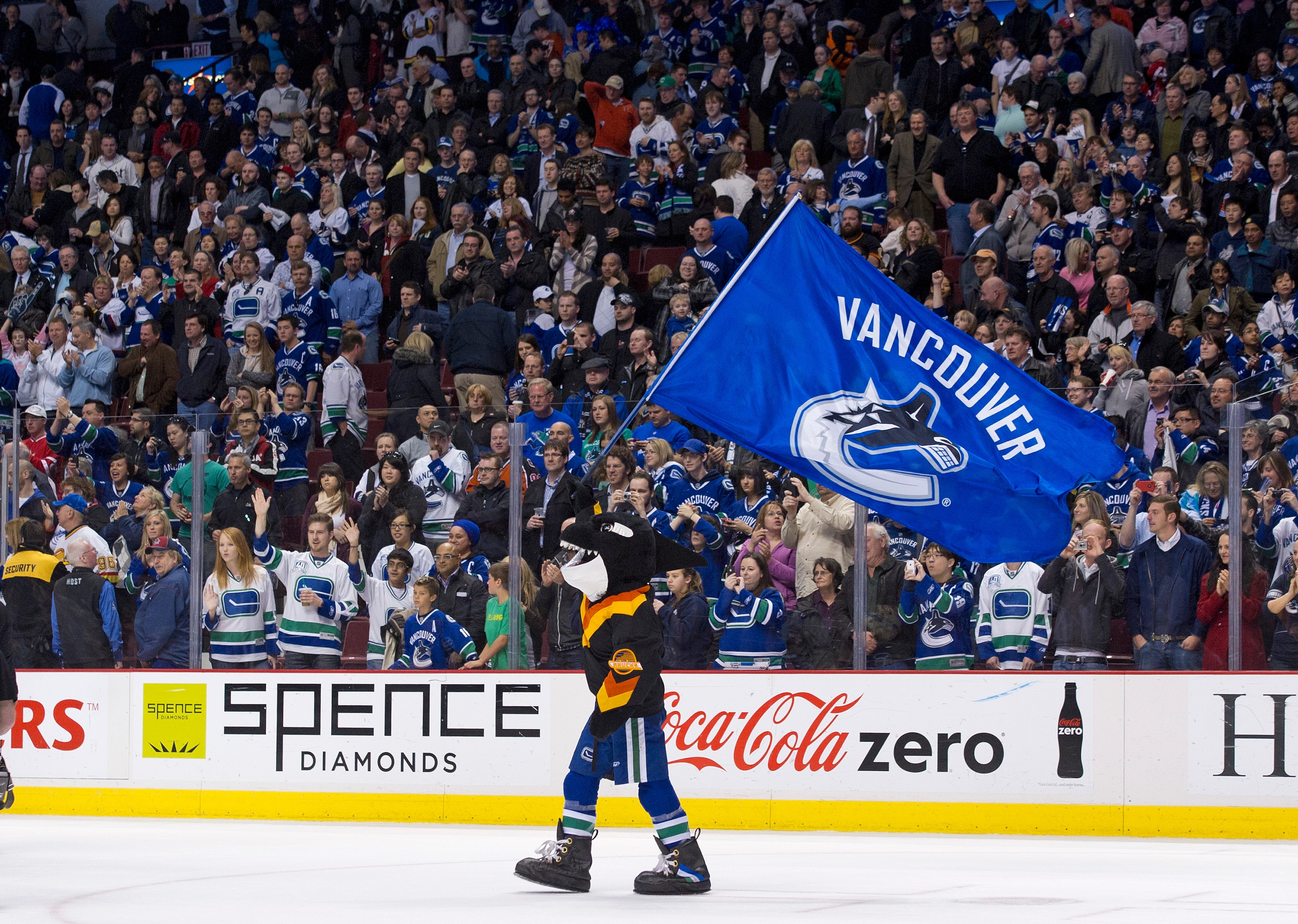 VANCOUVER, CANADA - APRIL 7: Fin, mascot of the Vancouver Canucks waves a team flag on the ice after the Vancouver Canucks defeated the Minnesota Wild in NHL action on April 07, 2011 at Rogers Arena in Vancouver, BC, Canada.  (Photo by Rich Lam/Getty Imag
