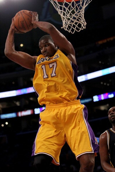 LOS ANGELES, CA - APRIL 05:  Andrew Bynum #17 of the Los Angeles Lakers grabs a rebound against the Utah Jazz at Staples Center on April 5, 2011 in Los Angeles, California. The Jazz won 86-85.  NOTE TO USER: User expressly acknowledges and agrees that, by
