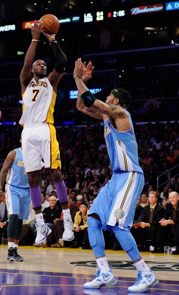 LOS ANGELES, CA - APRIL 03: Lamar Odom #7 of the  Los Angeles Lakers scores over Kenyon Martin #4 of the Denver Nuggets at Staples Center on April 3, 2011 in Los Angeles, California. NOTE TO USER: User expressly acknowledges and agrees that, by downloadin