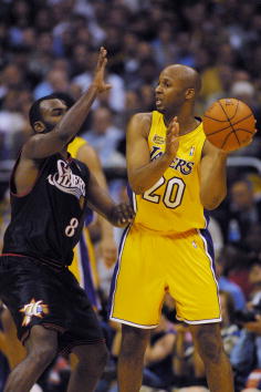 6 Jun 2001:  Brian Shaw #20 of the Los Angeles Lakers is defended by Aaron McKie #8 of the Philadelphia 76ers in game one of the NBA Finals at Staples Center in Los Angeles, California.  The 76ers won 107-101.  DIGITAL IMAGE.  Mandatory Credit: Jed Jacobs