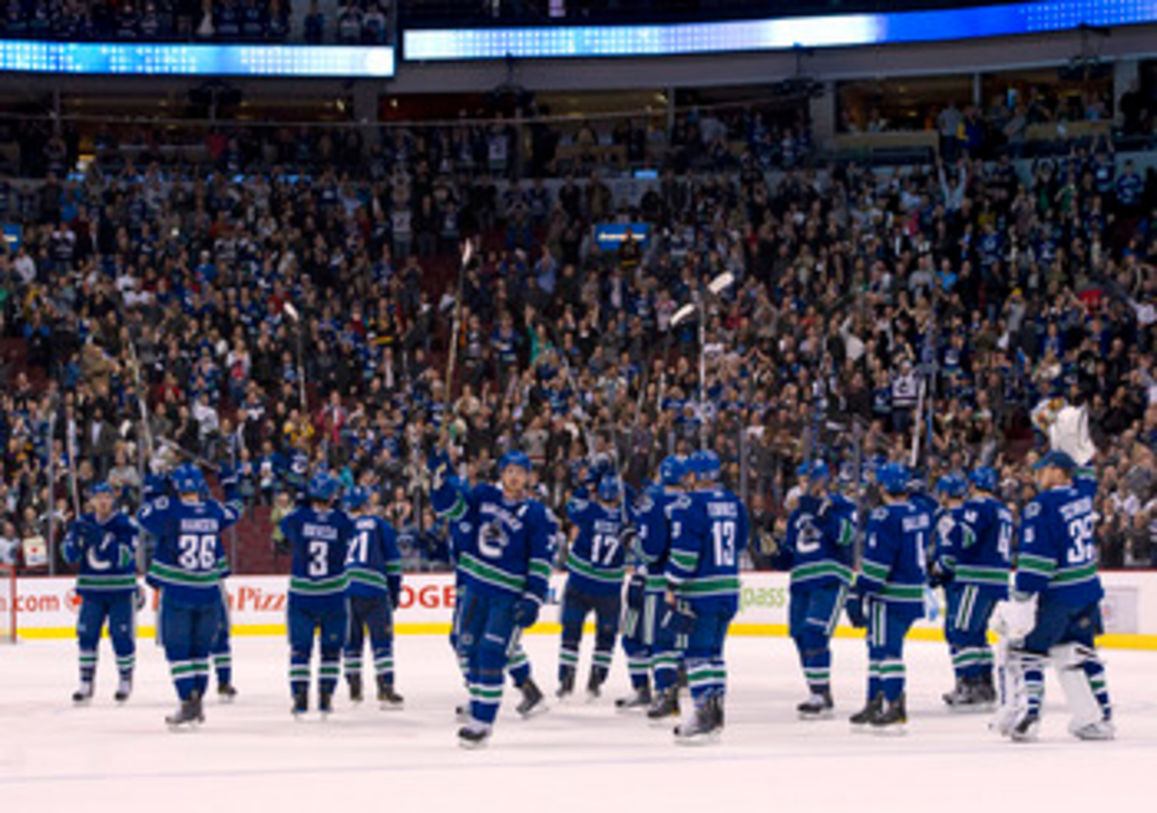 VANCOUVER, CANADA - MARCH 31: The Vancouver Canucks salut their fans after defeating the Los Angeles Kings in NHL action on March 31, 2011 at Rogers Arena in Vancouver, BC, Canada.  (Photo by Rich Lam/Getty Images)