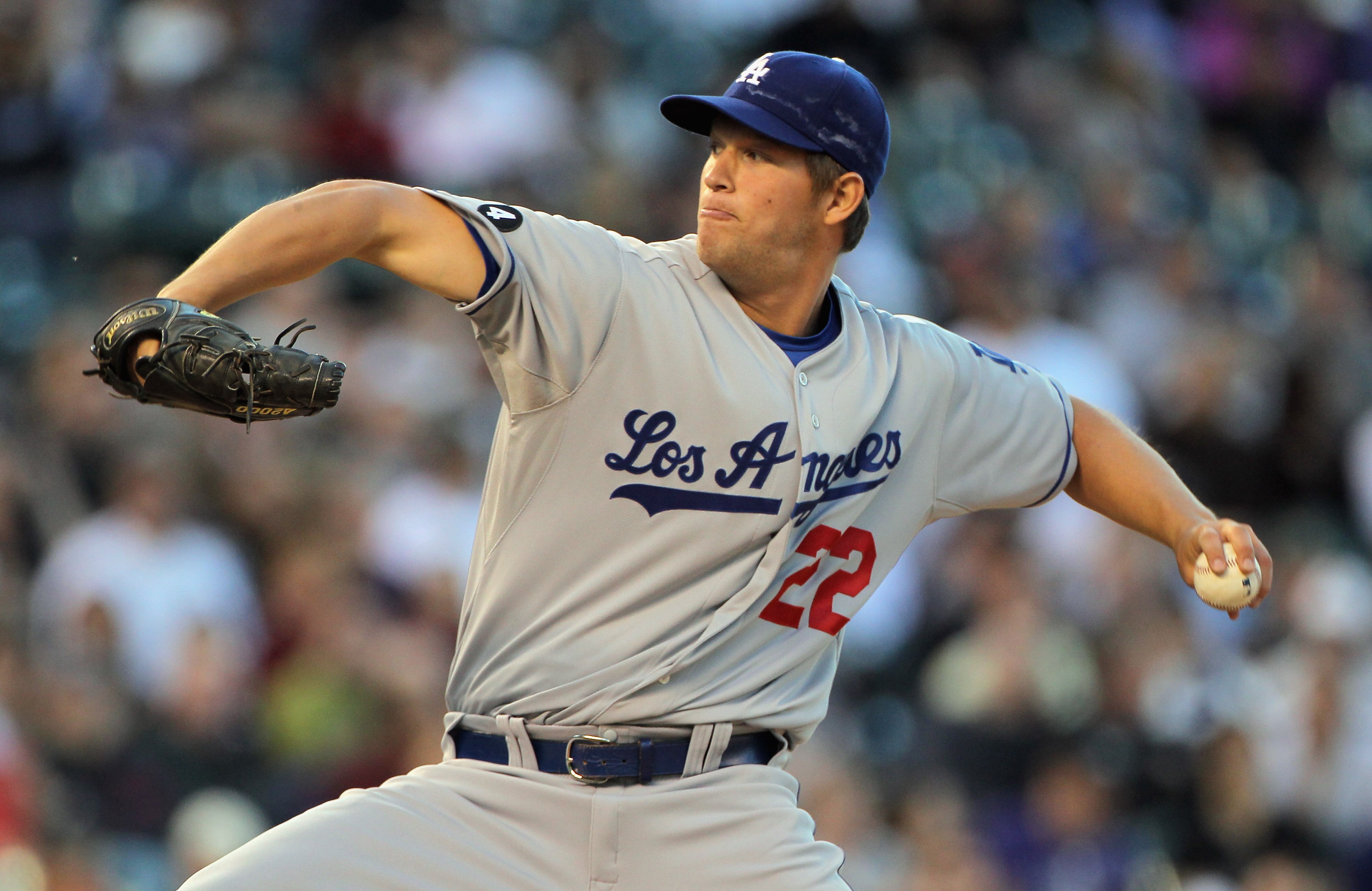 DENVER, CO - APRIL 05:  Starting pitcher Clayton Kershaw #22 of the Los Angeles Dodgers delivers against the Colorado Rockies at Coors Field on April 5, 2011 in Denver, Colorado. Kershaw collected the loss as the Rockies defeated the Dodgers 3-0.  (Photo