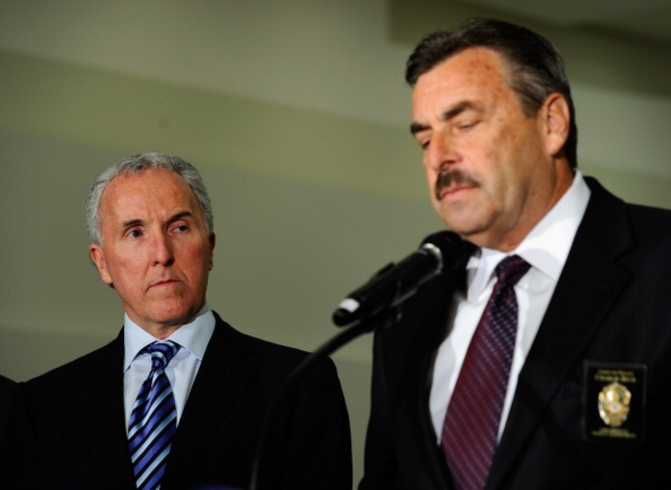 LOS ANGELES, CA - APRIL 08: Los Angeles Dodgers owner Frank McCourt looks on as Los Angeles Police Department Chief Charlie Beck speaks during a Dodger stadium security news conference to announce new security measures which will be implemented by LAPD a LOS ANGELES, CA - APRIL 08: Los Angeles Dodgers owner Frank McCourt looks on as Los Angeles Police Department Chief Charlie Beck speaks during a Dodger stadium security news conference to announce new security measures which will be implemented by LAPD a
