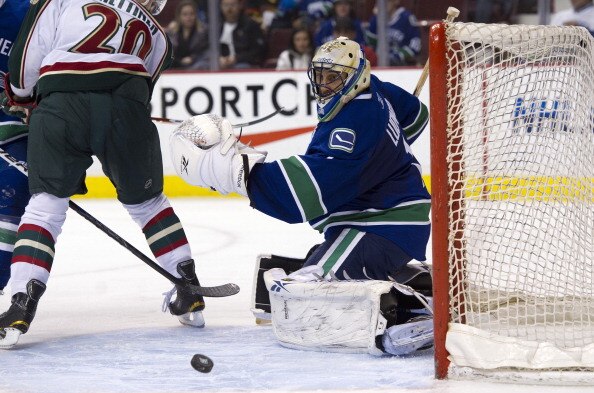 VANCOUVER, CANADA - APRIL 7: Goalie Roberto Luongo #1 of the Vancouver Canucks watches the puck slide across the front of his net from a Minnesota Wild shot during the third period in NHL action on April 07, 2011 at Rogers Arena in Vancouver, BC, Canada.