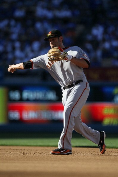 LOS ANGELES, CA - MARCH 31:  Freddy Sanchez #21 of the San Francisco Giants fields the ball against the Los Angeles Dodgers on Opening Day at Dodger Stadium on March 31, 2011 in Los Angeles, California.  (Photo by Jeff Gross/Getty Images)