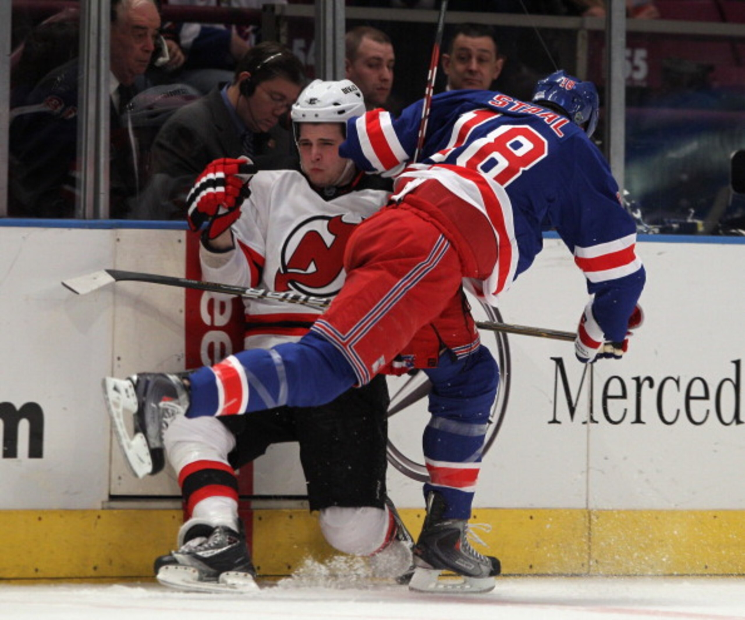 NEW YORK, NY - APRIL 09: Marc Staal #18 of the New York Rangers hits Nick Palmieri #32 of the New Jersey Devils at Madison Square Garden on April 9, 2011 in New York City. The Rangers defeated the Devils 5-2. (Photo by Bruce Bennett/Getty Images)