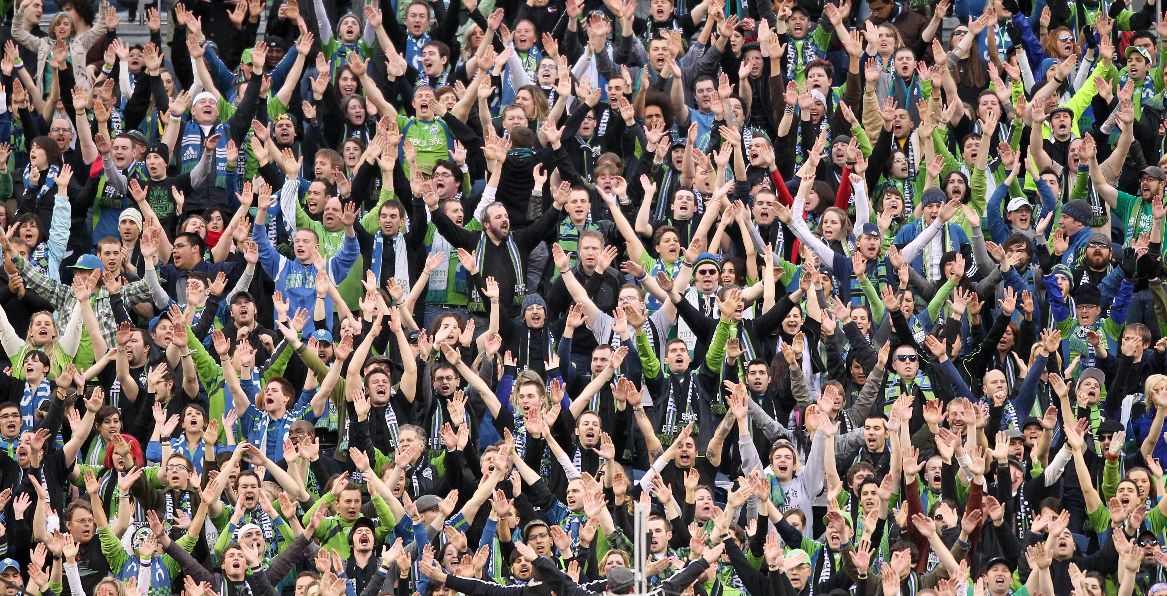 SEATTLE, WA - MARCH 25:  Fans of the Seattle Sounders FC cheer during the game against the Houston Dynamo at Qwest Field on March 25, 2011 in Seattle, Washington. (Photo by Otto Greule Jr/Getty Images)