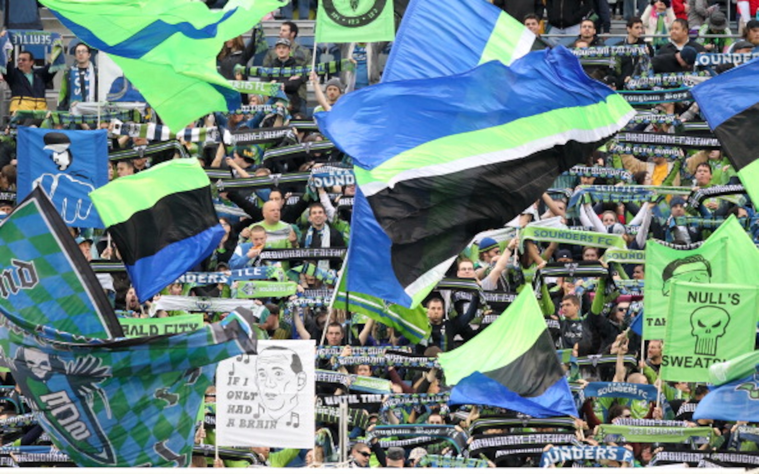 SEATTLE, WA - MARCH 25:  Fans of the Seattle Sounders FC wave flags prior to the game against the Houston Dynamo at Qwest Field on March 25, 2011 in Seattle, Washington. (Photo by Otto Greule Jr/Getty Images)