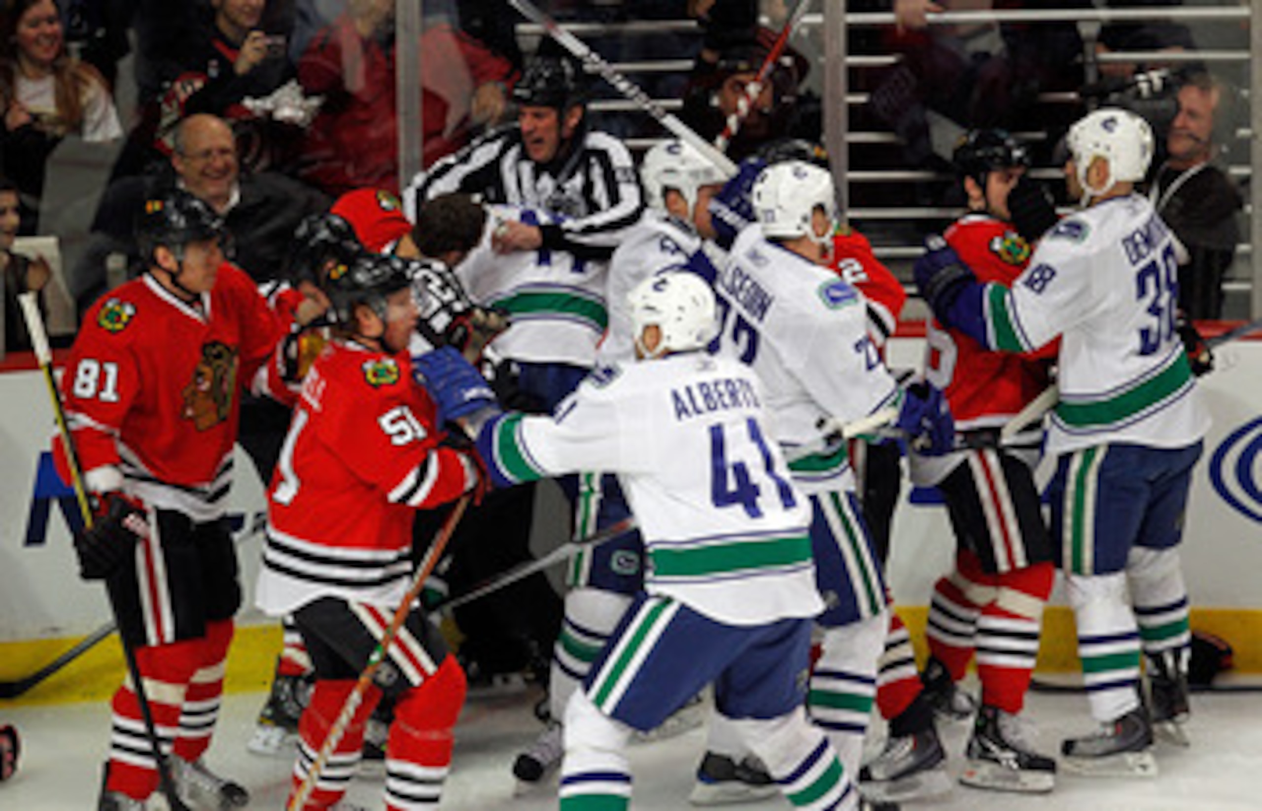 CHICAGO - MARCH 05:  A melee breaks out between the Chicago Blackhawks and the Vancouver Canucks in the first minute of play after Andrew Ladd of the Blackhawks and Ryan Kesler of the Canucks start a fight at the United Center on March 5, 2010 in Chicago,