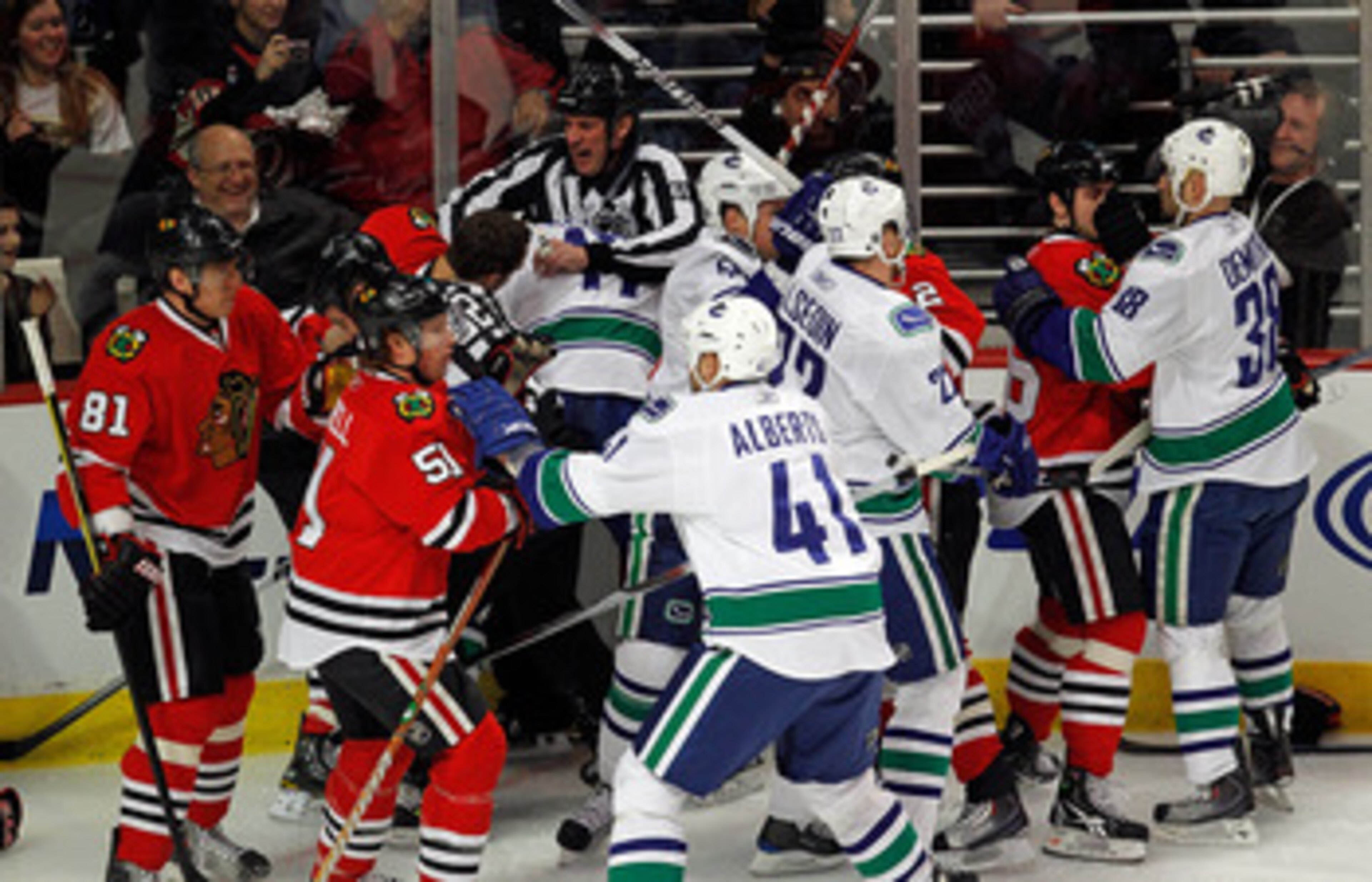 CHICAGO - MARCH 05:  A melee breaks out between the Chicago Blackhawks and the Vancouver Canucks in the first minute of play after Andrew Ladd of the Blackhawks and Ryan Kesler of the Canucks start a fight at the United Center on March 5, 2010 in Chicago,