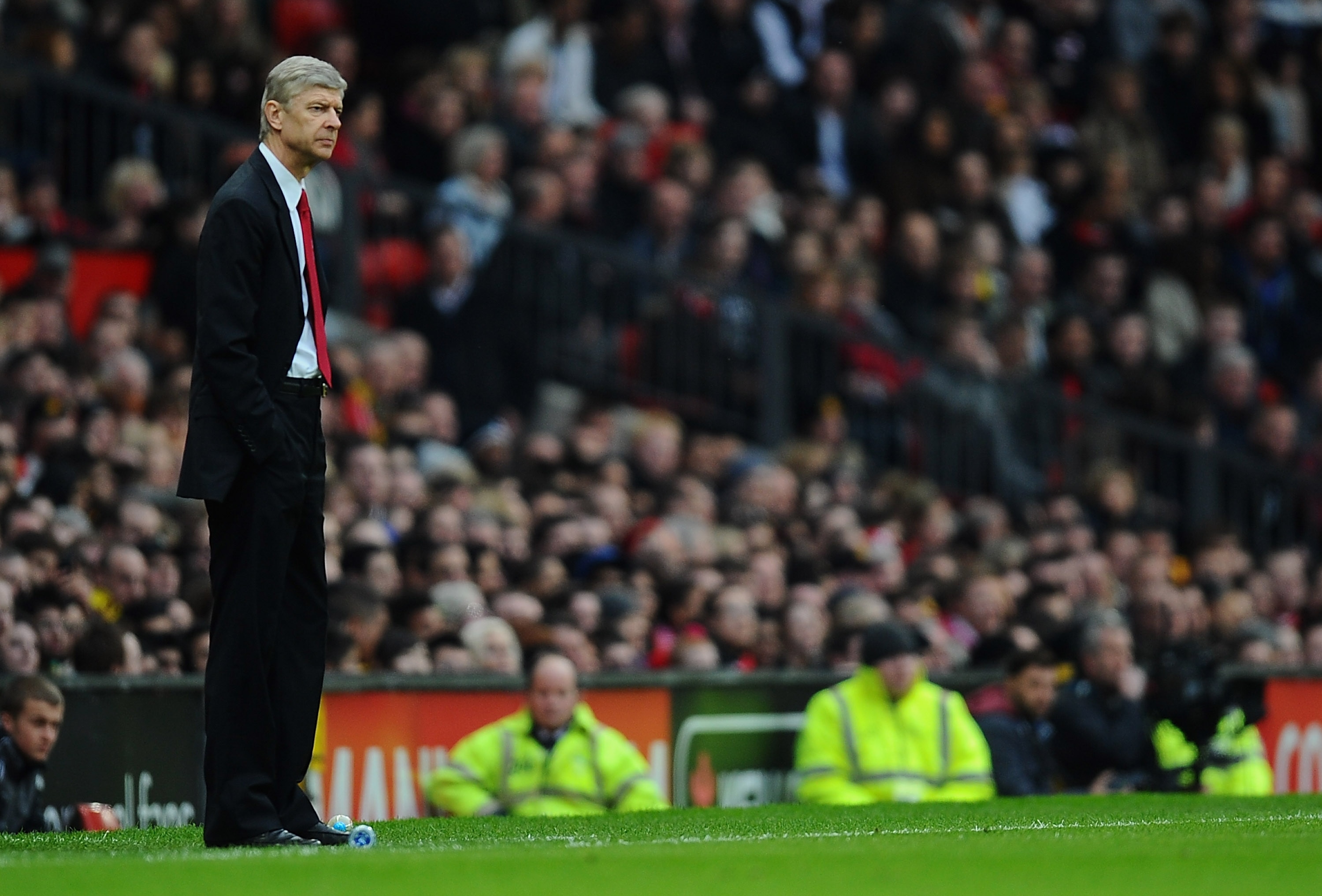 MANCHESTER, ENGLAND - MARCH 12:  Arsenal manager Arsene Wenger looks on during the FA Cup sponsored by E.On Sixth Round match between Manchester United and Arsenal at Old Trafford on March 12, 2011 in Manchester, England.  (Photo by Clive Mason/Getty Imag