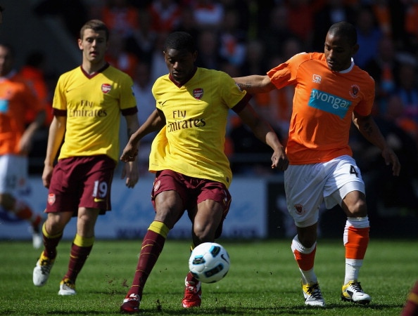 BLACKPOOL, ENGLAND - APRIL 10:  Abou Diaby of Arsenal holds off Jason Puncheon of Blackpool during the Barclays Premier League match between Blackpool and Arsenal at Bloomfield Road on April 10, 2011 in Blackpool, England.  (Photo by Alex Livesey/Getty Im