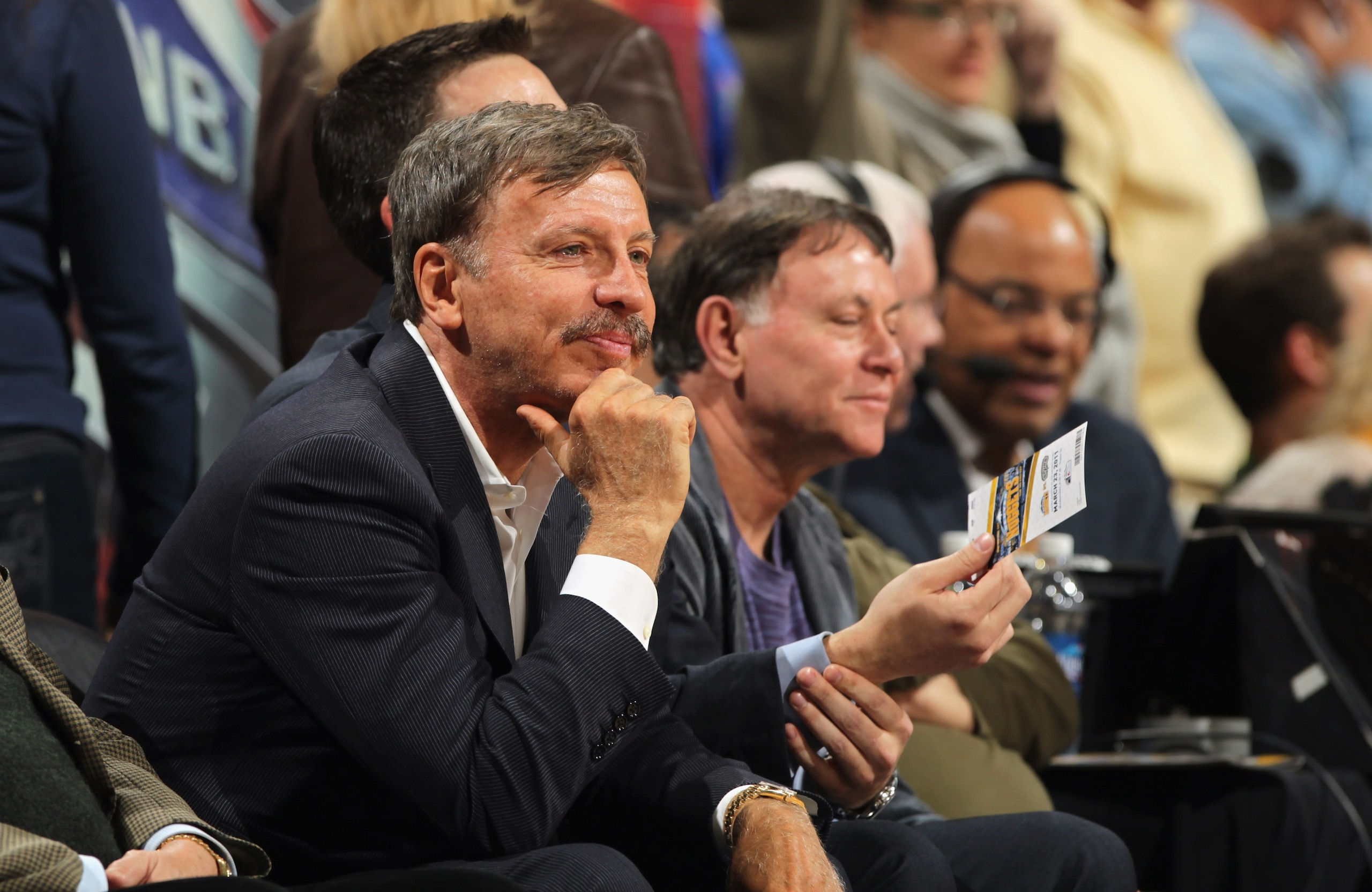 DENVER, CO - MARCH 23: Stan Kroenke (L) watches from courtside seats as the Denver Nuggets host the San Antonio Spurs at the Pepsi Center on March 23, 2011 in Denver, Colorado. The Nuggets defeated the Spurs 115-112. NOTE TO USER: User expressly acknowle DENVER, CO - MARCH 23: Stan Kroenke (L) watches from courtside seats as the Denver Nuggets host the San Antonio Spurs at the Pepsi Center on March 23, 2011 in Denver, Colorado. The Nuggets defeated the Spurs 115-112. NOTE TO USER: User expressly acknowle