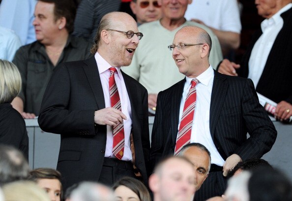 MANCHESTER, ENGLAND - APRIL 09: Manchester United Co-Chairmen Joel Glazer (R) and Avram Glazer talk during the Barclays Premier League match between Manchester United and Fulham at Old Trafford on April 9, 2011 in Manchester, England.  (Photo by Michael R