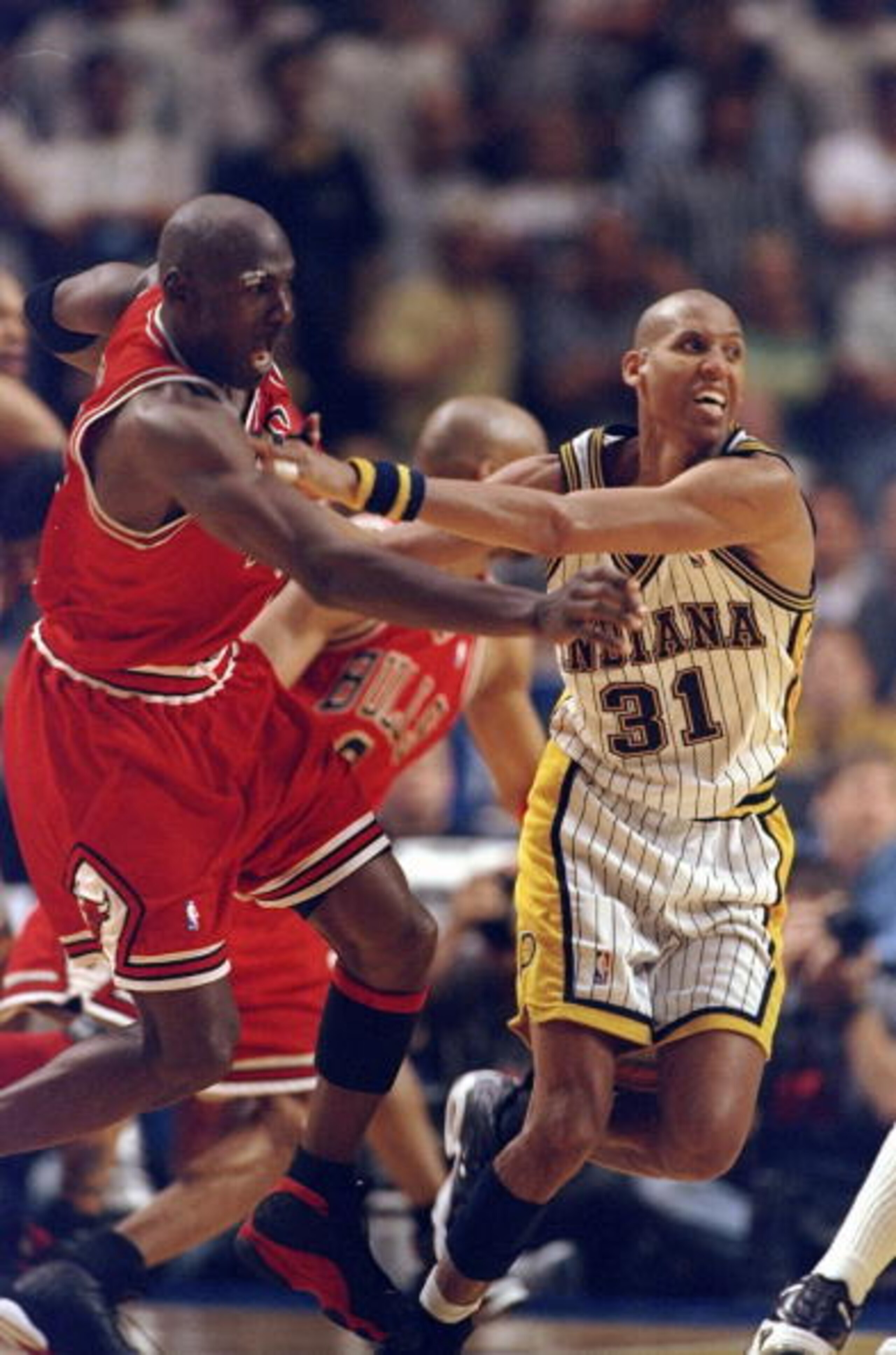 25 May, 1998:  Reggie Miller #31 pushes Michael Jordan #23 for the winning 3 pointer of game six during the NBA Eastern Conference Finals at the Market Square Arena in Indianapolis, Indiana.  The Pacers defeated the Bulls 96-94. Mandatory Credit: Vincent