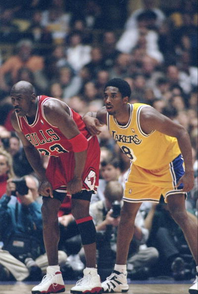 1 Feb 1998:  Guard Michael Jordan of the Chicago Bulls (left) and guard Kobe Bryant of the Los Angeles Lakers look on during a game at the Great Western Forum in Inglewood, California.  The Lakers won the game, 112-87. Mandatory Credit: Jed Jacobsohn  /Al