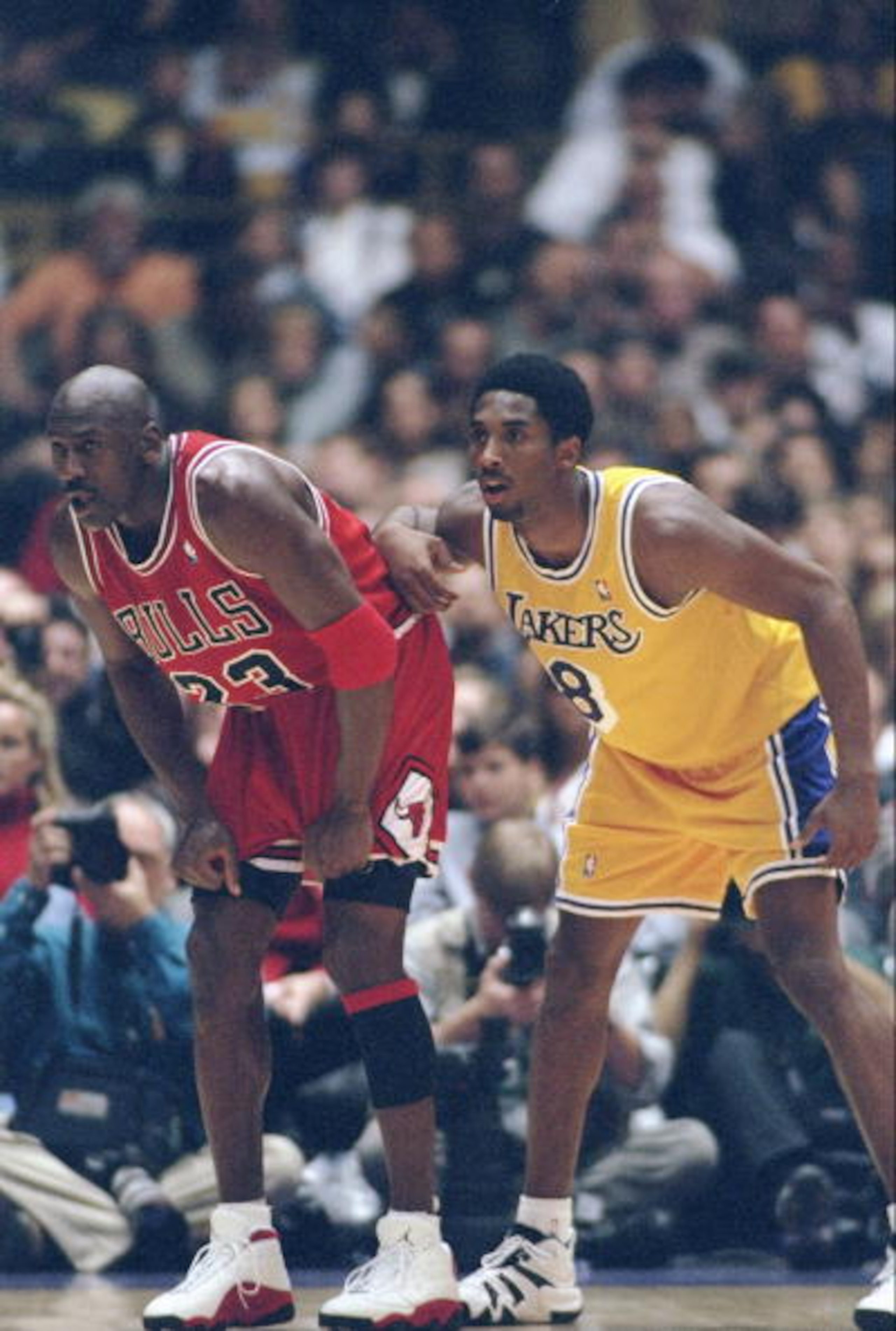 1 Feb 1998:  Guard Michael Jordan of the Chicago Bulls (left) and guard Kobe Bryant of the Los Angeles Lakers look on during a game at the Great Western Forum in Inglewood, California.  The Lakers won the game, 112-87. Mandatory Credit: Jed Jacobsohn  /Al