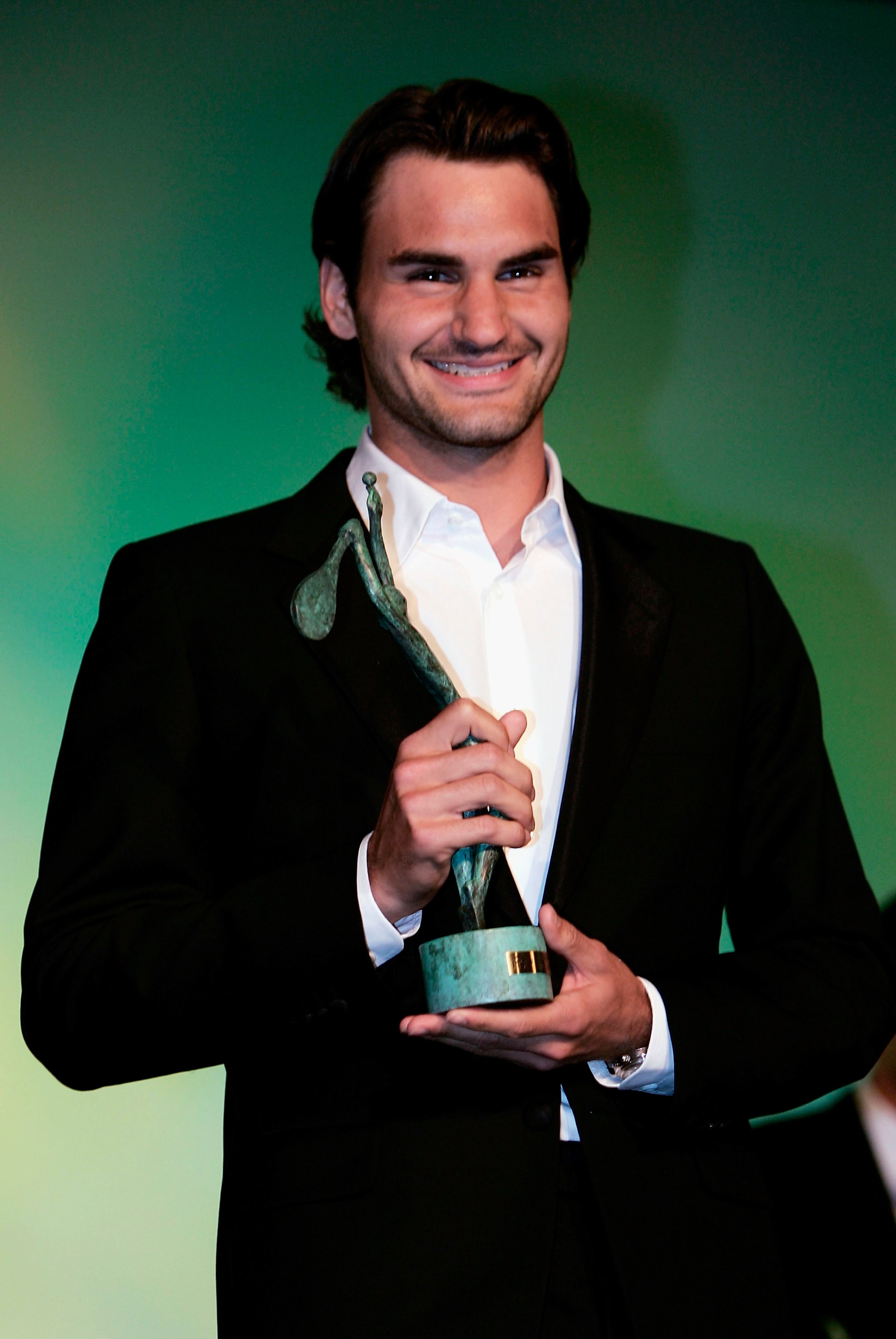 PARIS - MAY 31:  Roger Federer of Switzerland poses for a photo after being awarded singles champion of 2004 after the ninth day of the French Open at Roland Garros on May 31, 2005 in Paris, France.  (Photo by Clive Brunskill/Getty Images)