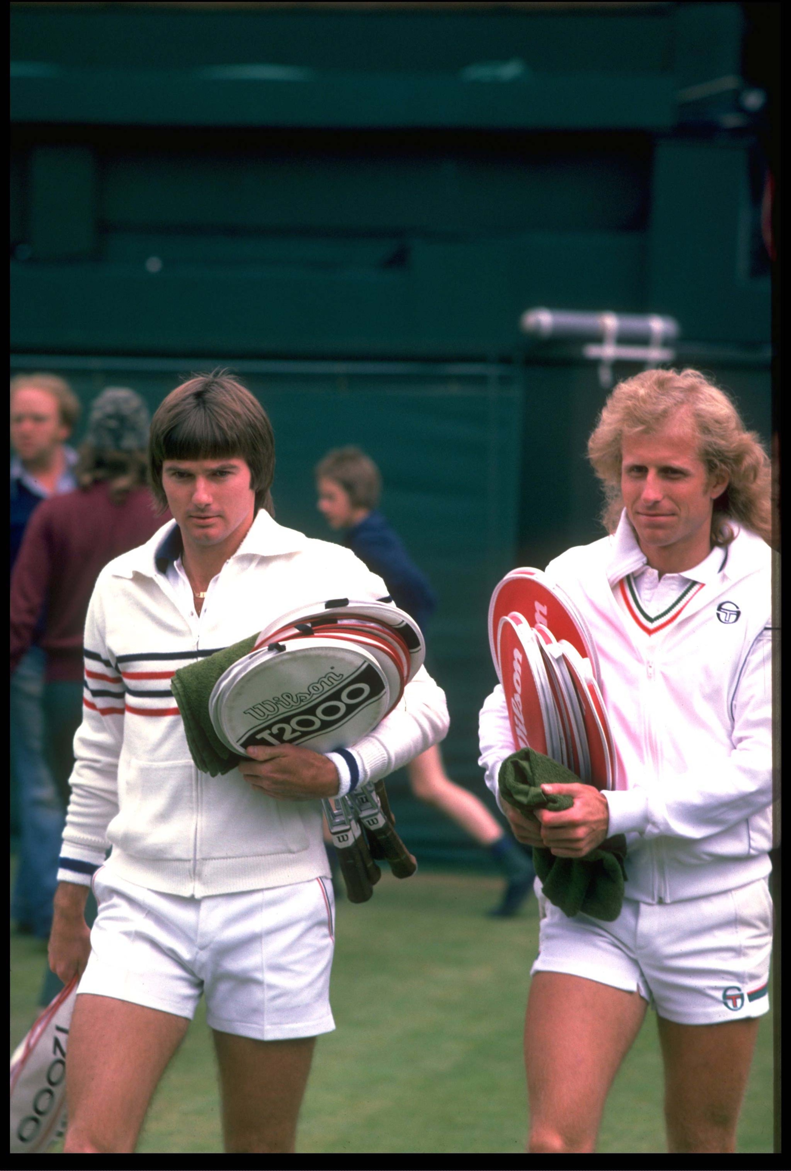 JUN 1978:  JIMMY CONNERS OF THE UNITED STATES AND VITAS GERULAITIS OF THE UNITED STATES ENTER CENTER COURT BEFORE THEIR MATCH AT THE 1978 WIMBLEDON CHAMPIONSHIPS.