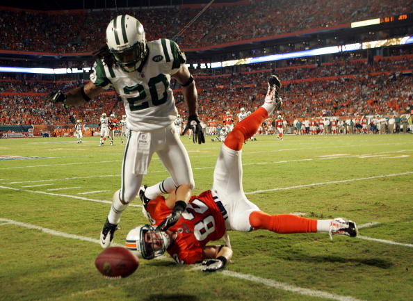 MIAMI - SEPTEMBER 26:  Cornerback Kyle Wilson #20 of the New York Jets is called for pass interference on Receiver Brian Hartline #82 of the Miami Dolphins at Sun Life Stadium on September 26, 2010 in Miami, Florida.  (Photo by Marc Serota/Getty Images)