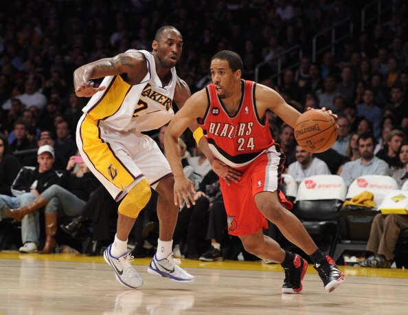 LOS ANGELES, CA - MARCH 20:  Andre Miller #24 of the Portland Trail Blazers dribbles around Kobe Bryant #24 of the Los Angeles Lakers at the Staples Center on March 20, 2011 in Los Angeles, California.  NOTE TO USER: User expressly acknowledges and agrees