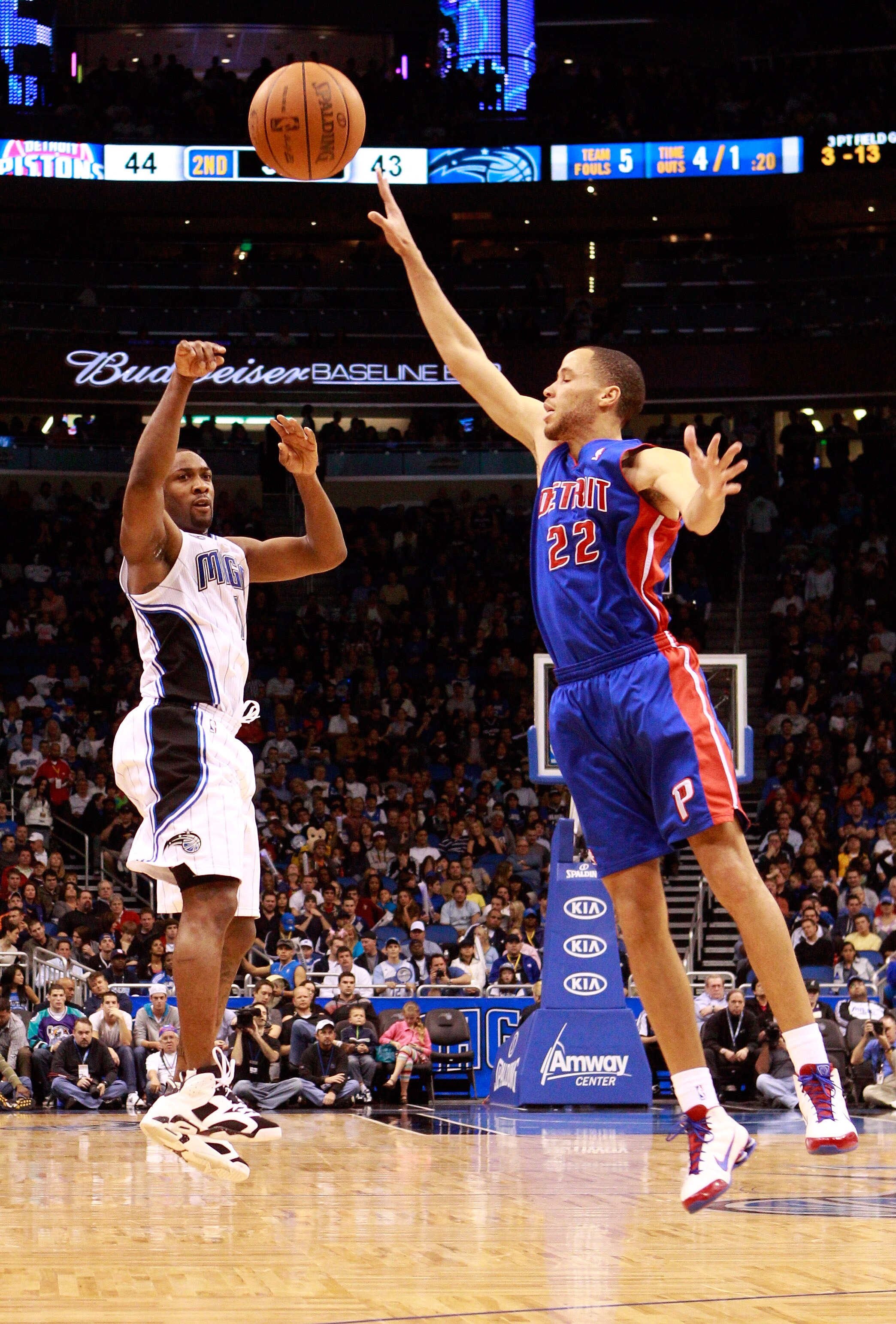 ORLANDO, FL - JANUARY 24:  Tayshaun Prince #22 of the Detroit Pistons attempts to block the pass of Gilbert Arenas #1 of the Orlando Magic during the game at Amway Arena on January 24, 2011 in Orlando, Florida.  NOTE TO USER: User expressly acknowledges a