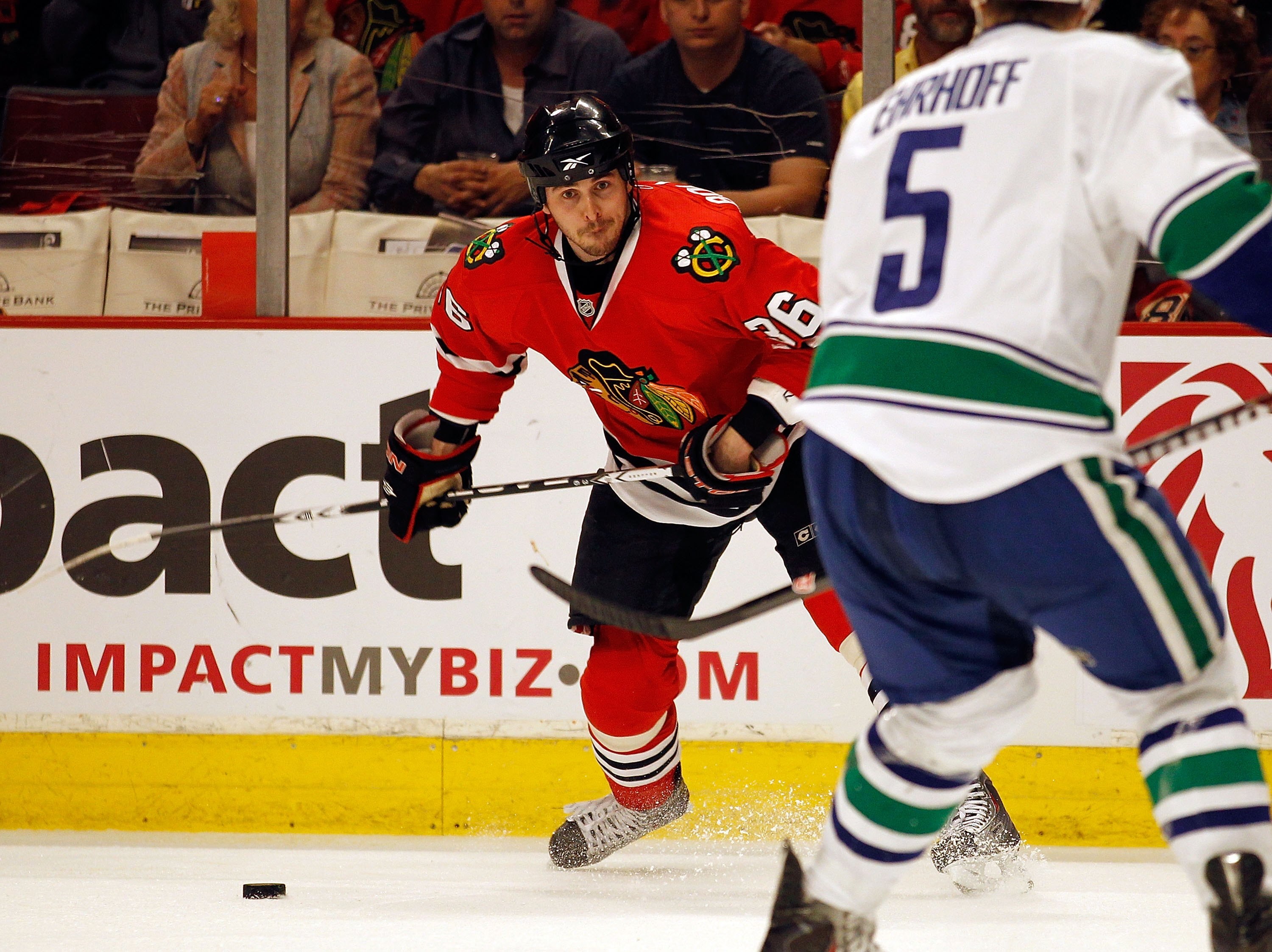 CHICAGO - MAY 01: Dave Bolland #36 of the Chicago Blackhawks prepares to shoot past Chrsitian Ehrhoff #5 of the Vancouver Canucks in Game One of the Western Conference Semifinals during the 2010 NHL Stanley Cup Playoffs at United Center on May 1, 2010 in