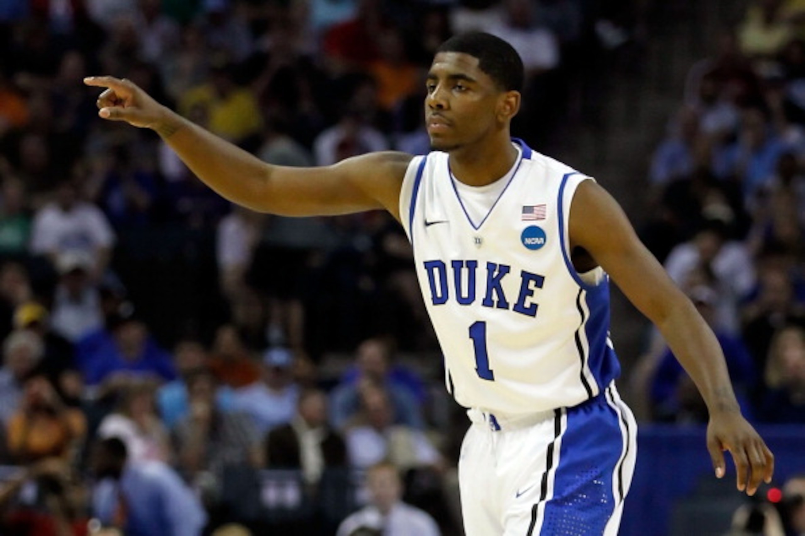 CHARLOTTE, NC - MARCH 18:  Kyrie Irving #1 of the Duke Blue Devils points in the first half while taking on the Hampton Pirates during the second round of the 2011 NCAA men's basketball tournament at Time Warner Cable Arena on March 18, 2011 in Charlotte,