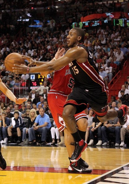 MIAMI, FL - MARCH 06: Mario Chalmers #15 of the Miami Heat chases down a loose ball during a game against the Chicago Bulls at American Airlines Arena on March 6, 2011 in Miami, Florida. NOTE TO USER: User expressly acknowledges and agrees that, by downlo