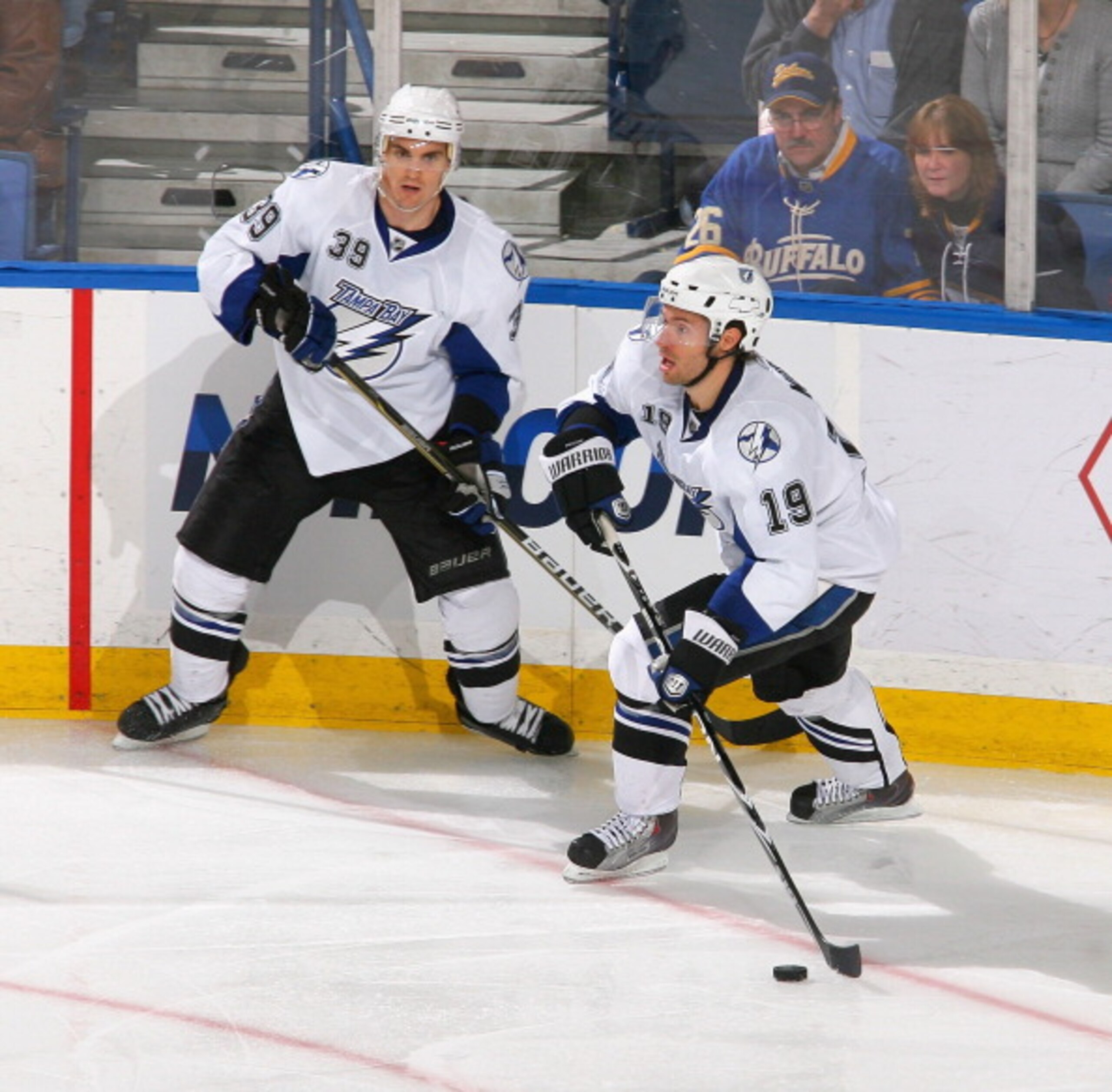 BUFFALO, NY - APRIL 05: Dominic Moore #19 and Mike Lundin #39  of the Tampa Bay Lightning skate against the Buffalo Sabres  at HSBC Arena on April 5, 2011 in Buffalo, New York.  (Photo by Rick Stewart/Getty Images)
