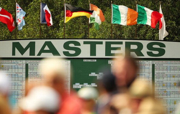 AUGUSTA, GA - APRIL 09:  Patrons are seen watching the play near a leaderboard during the third round of the 2011 Masters Tournament at Augusta National Golf Club on April 9, 2011 in Augusta, Georgia.  (Photo by Jamie Squire/Getty Images)