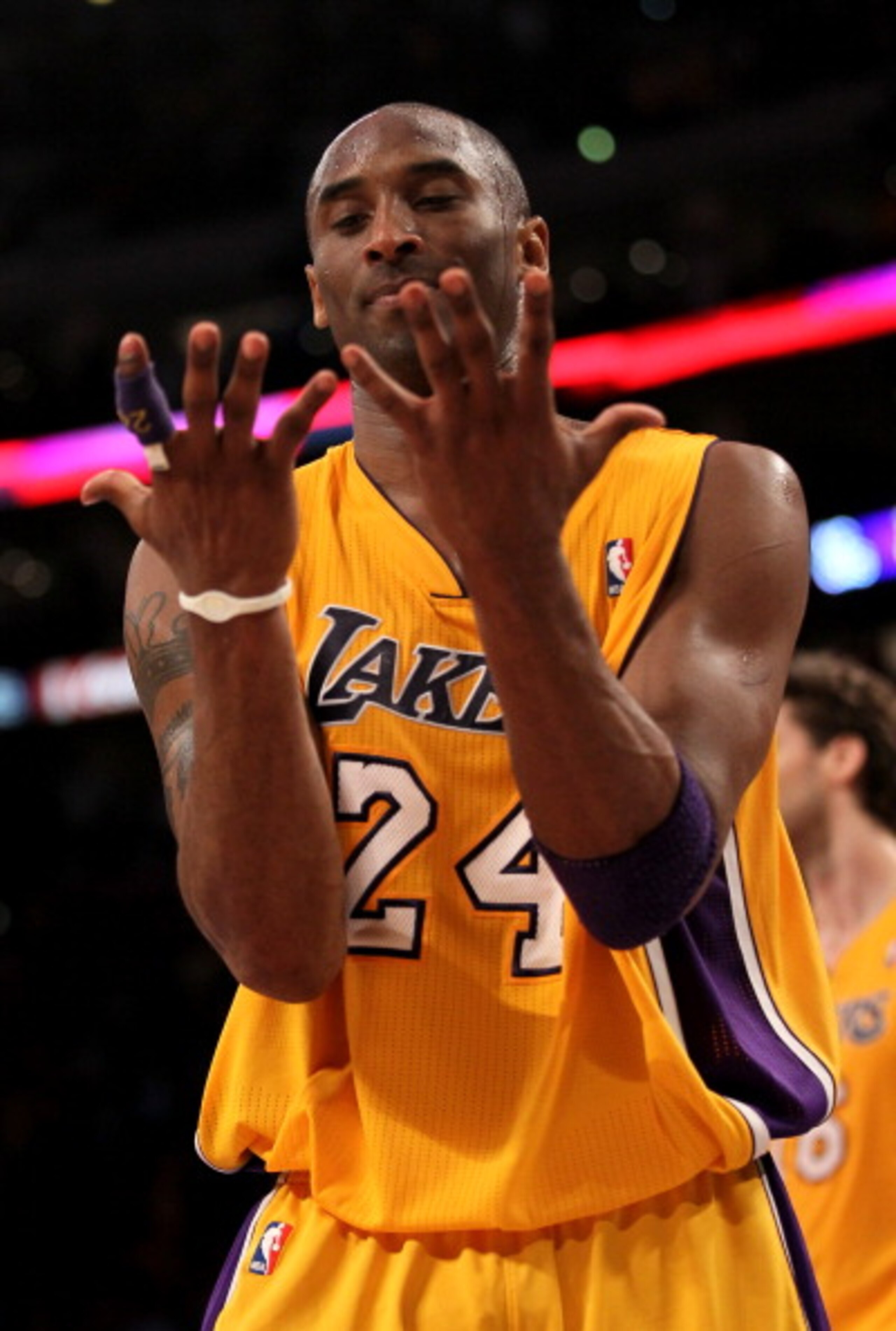 LOS ANGELES, CA - APRIL 5: Kobe Bryant #24 of the Los Angeles Lakers looks at his hands as he walks off the court after losing control of the ball while going for the potential game winning shot in the final seconds against the Utah Jazz at Staples Cente LOS ANGELES, CA - APRIL 5: Kobe Bryant #24 of the Los Angeles Lakers looks at his hands as he walks off the court after losing control of the ball while going for the potential game winning shot in the final seconds against the Utah Jazz at Staples Cente