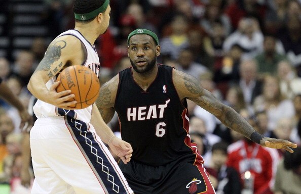 NEWARK, NJ - APRIL 03:  LeBron James #6 of the Miami Heat defends against Deron Williams #8 of the New Jersey Nets at the Prudential Center on April 3, 2011 in Newark, New Jersey.The Heat defeated the Nets 108-94.NOTE TO USER: User expressly acknowledges