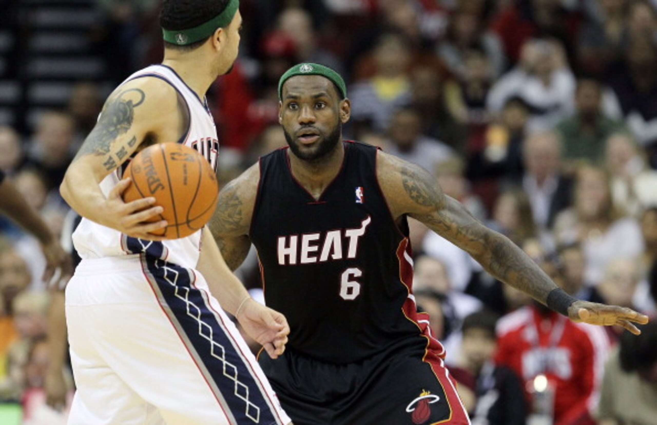 NEWARK, NJ - APRIL 03: LeBron James #6 of the Miami Heat defends against Deron Williams #8 of the New Jersey Nets at the Prudential Center on April 3, 2011 in Newark, New Jersey.The Heat defeated the Nets 108-94.NOTE TO USER: User expressly acknowledges NEWARK, NJ - APRIL 03: LeBron James #6 of the Miami Heat defends against Deron Williams #8 of the New Jersey Nets at the Prudential Center on April 3, 2011 in Newark, New Jersey.The Heat defeated the Nets 108-94.NOTE TO USER: User expressly acknowledges