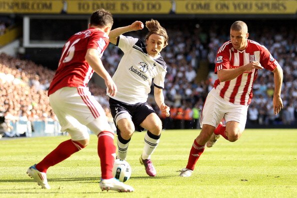 LONDON, ENGLAND - APRIL 09:  Luka Modric of Spurs is closed down by Salif Diao and Jonathan Walters of Stoke during the Barclays Premier League match between Tottenham Hotspur and Stoke City at White Hart Lane on April 9, 2011 in London, England.  (Photo