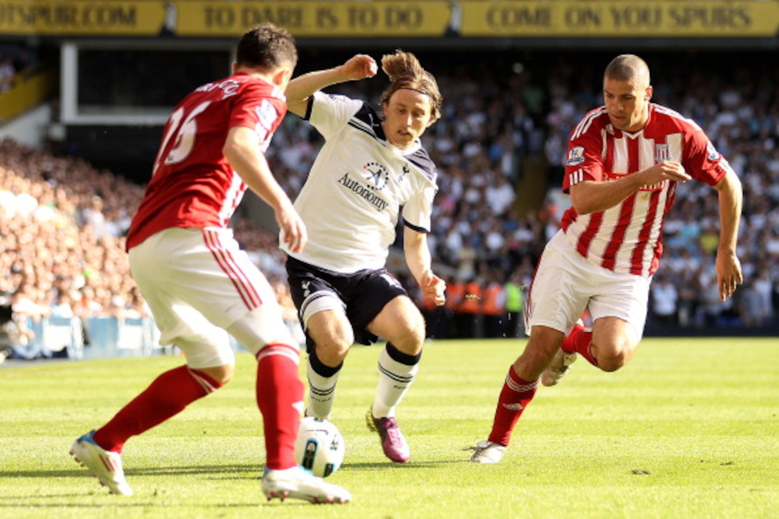 LONDON, ENGLAND - APRIL 09:  Luka Modric of Spurs is closed down by Salif Diao and Jonathan Walters of Stoke during the Barclays Premier League match between Tottenham Hotspur and Stoke City at White Hart Lane on April 9, 2011 in London, England.  (Photo