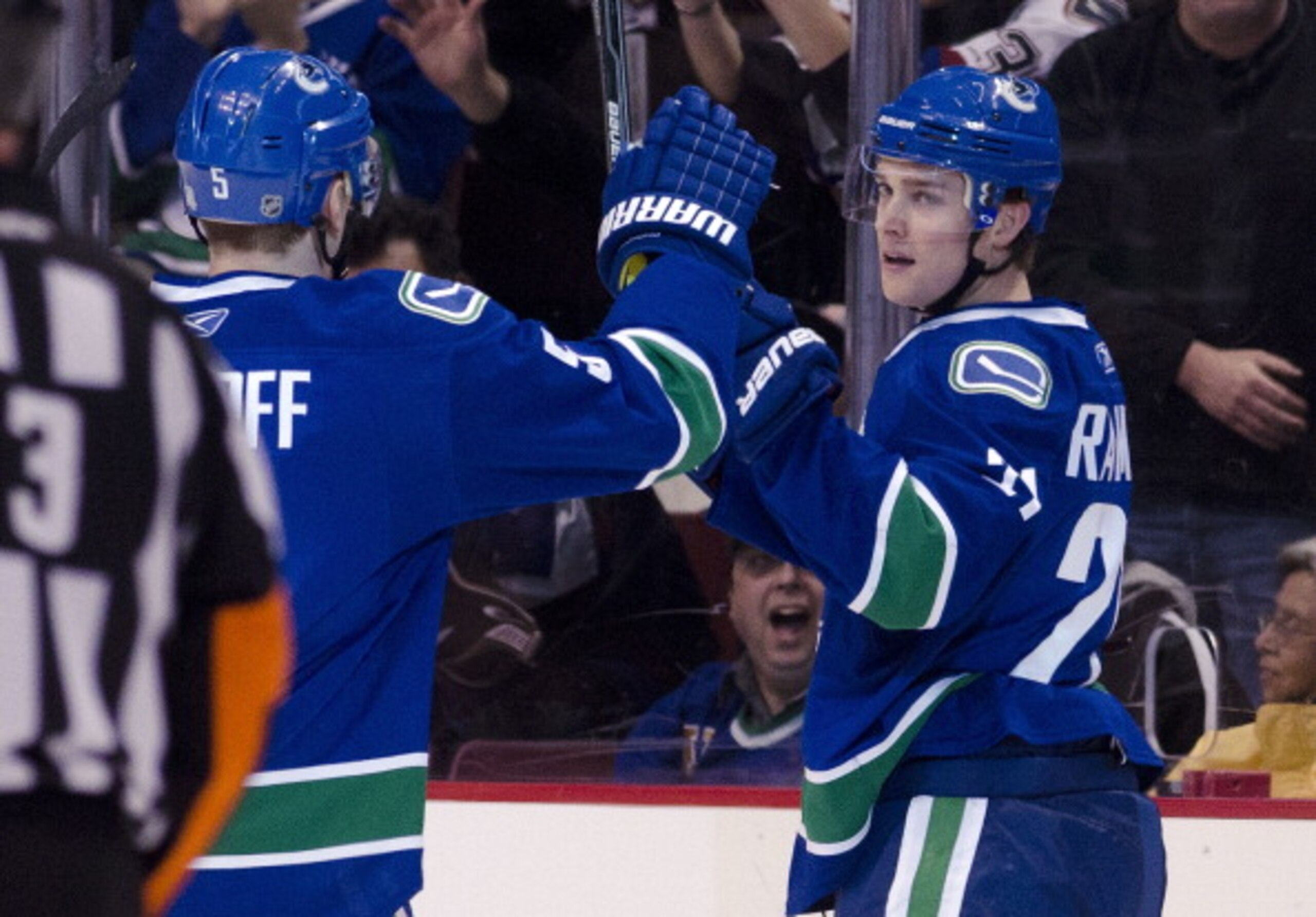 VANCOUVER, CANADA - APRIL 7: Mason Raymond #21of the Vancouver Canucks in congratulated by Christian Ehrhoff #5 after scoring against the Minnesota Wild during the first period in NHL action on April 07, 2011 at Rogers Arena in Vancouver, BC, Canada.  (Ph