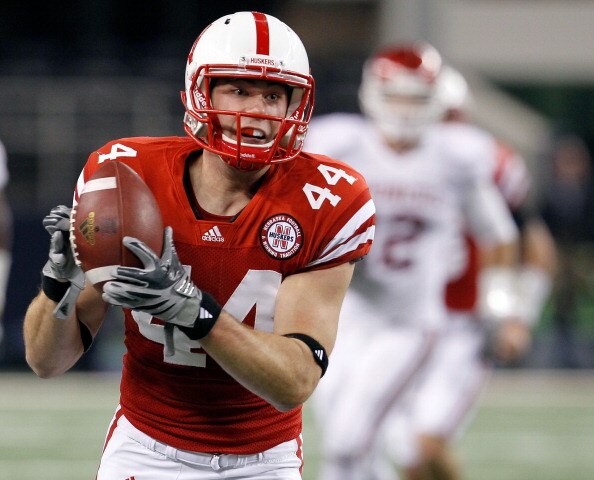 ARLINGTON, TX - DECEMBER 04:  Wide receiver Mike McNeil #44 of the Nebraska Cornhuskers pulls in a pass against the Oklahoma Sooners at Cowboys Stadium on December 4, 2010 in Arlington, Texas.  The Sooners beat the Cornhuskers 23-20.  (Photo by Tom Pennin
